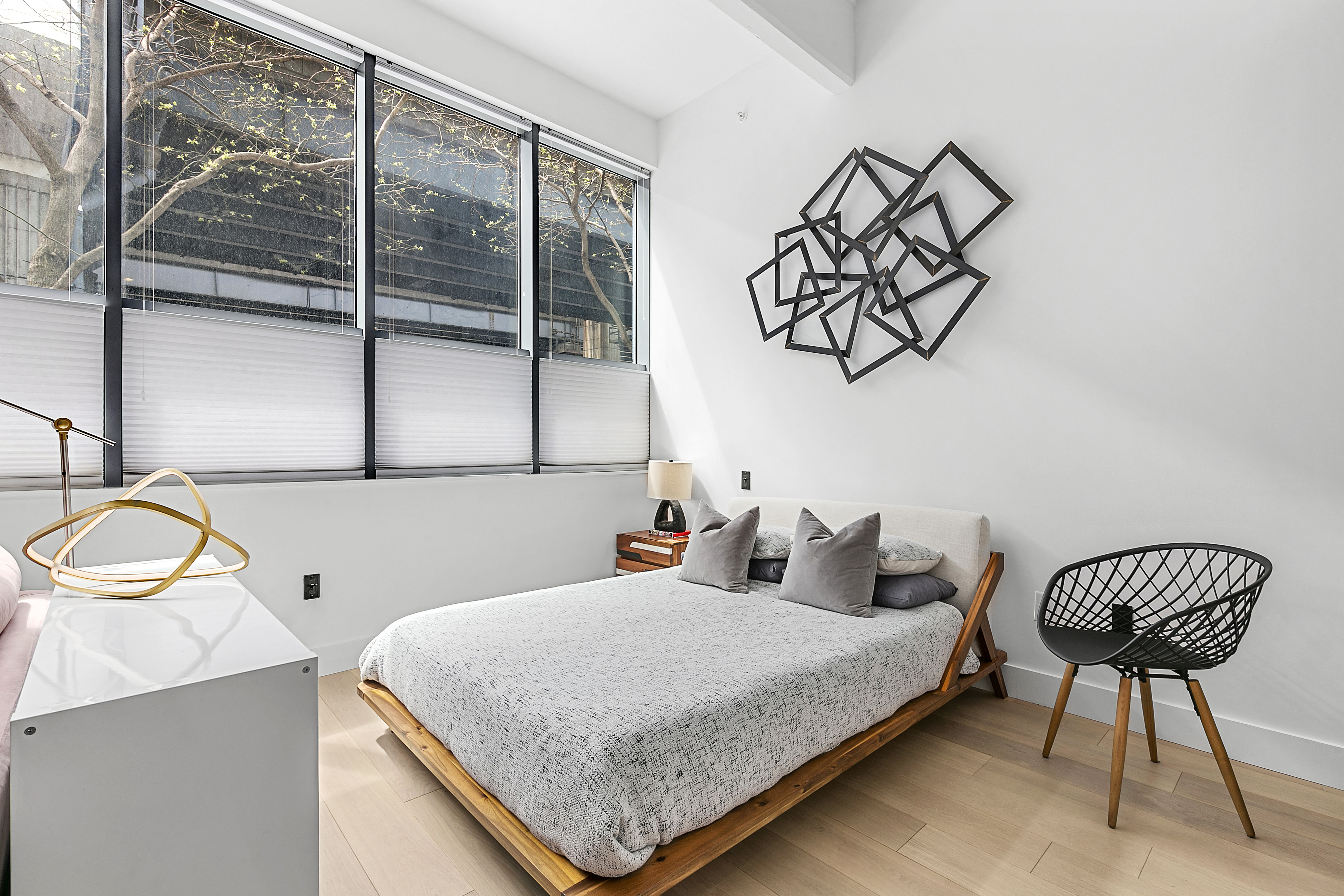 338 Berry Street, Unit 1B Brooklyn, NY 11249 - Photo 2 of 13 a bedroom with a bed and a window