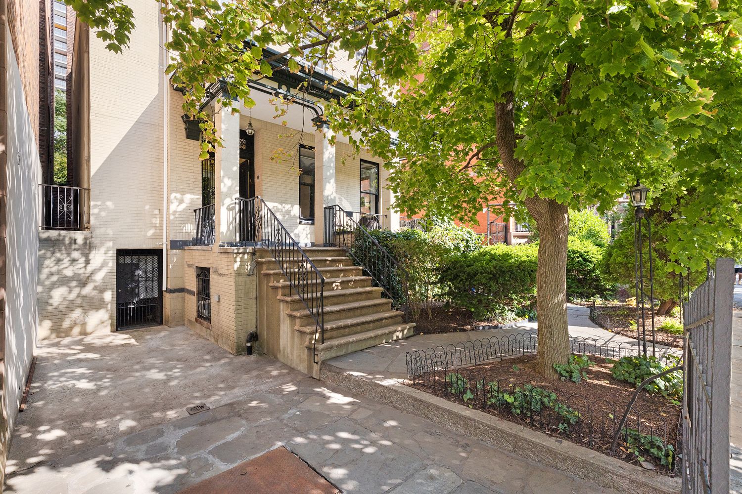 315 Washington Avenue Brooklyn, NY 11205 - Photo 27 of 38 a front view of a house with a garden