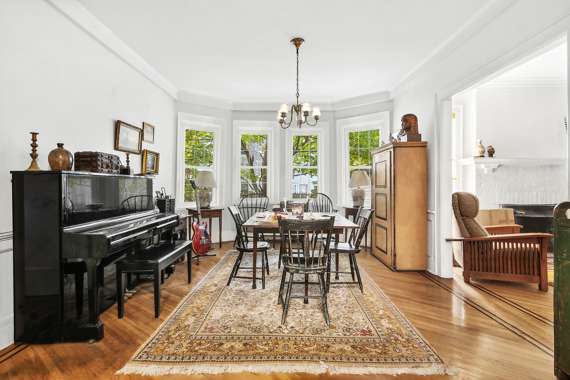 819 East 19th Street Brooklyn, NY 11230 - Photo 3 of 16 a living room with furniture a large window and a dining table