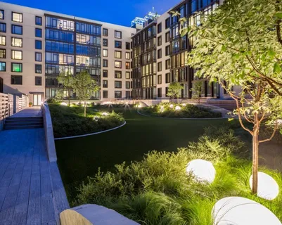 a view of swimming pool with outdoor seating and plants
