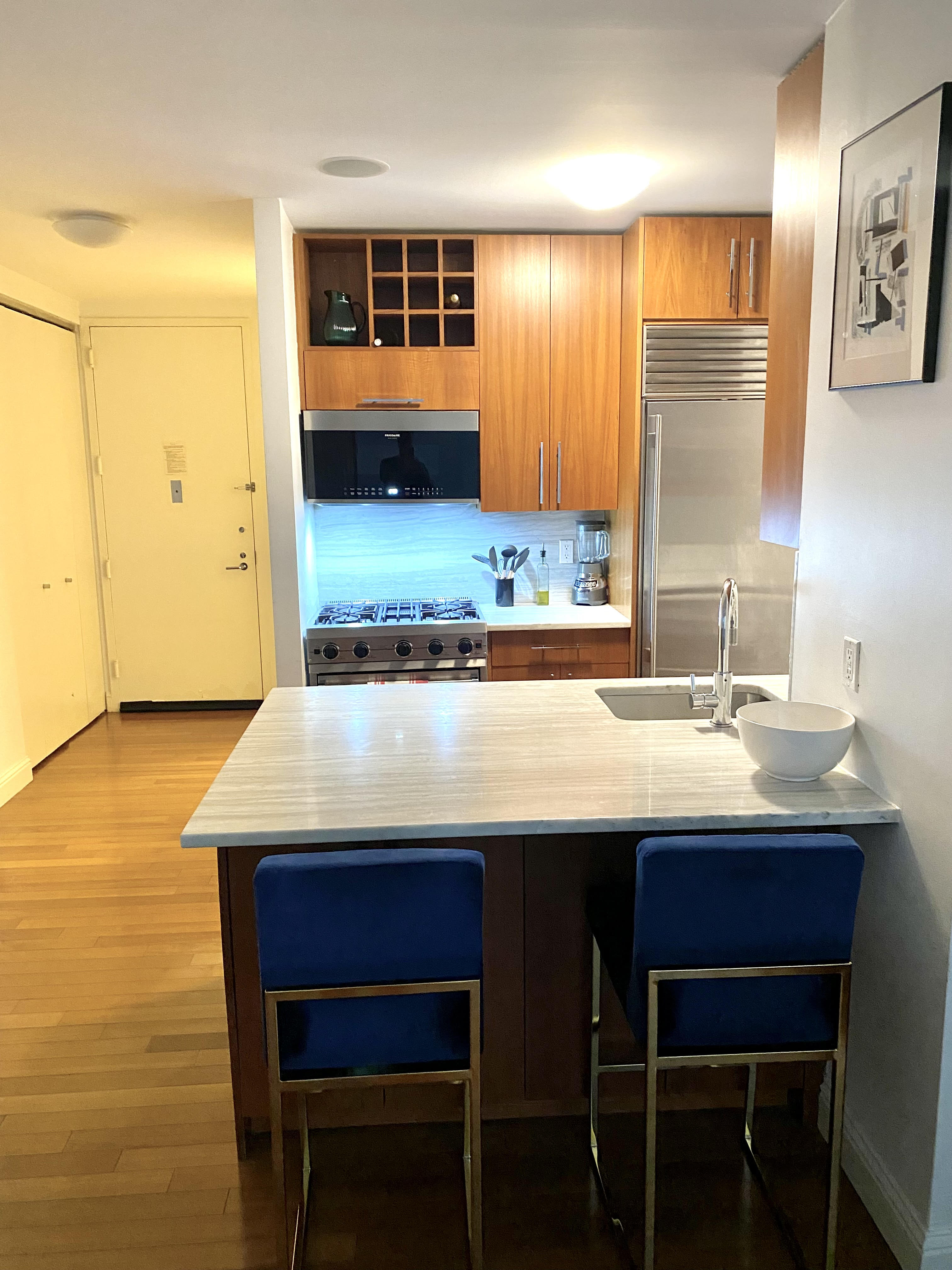 a kitchen with a sink and a wooden cabinets