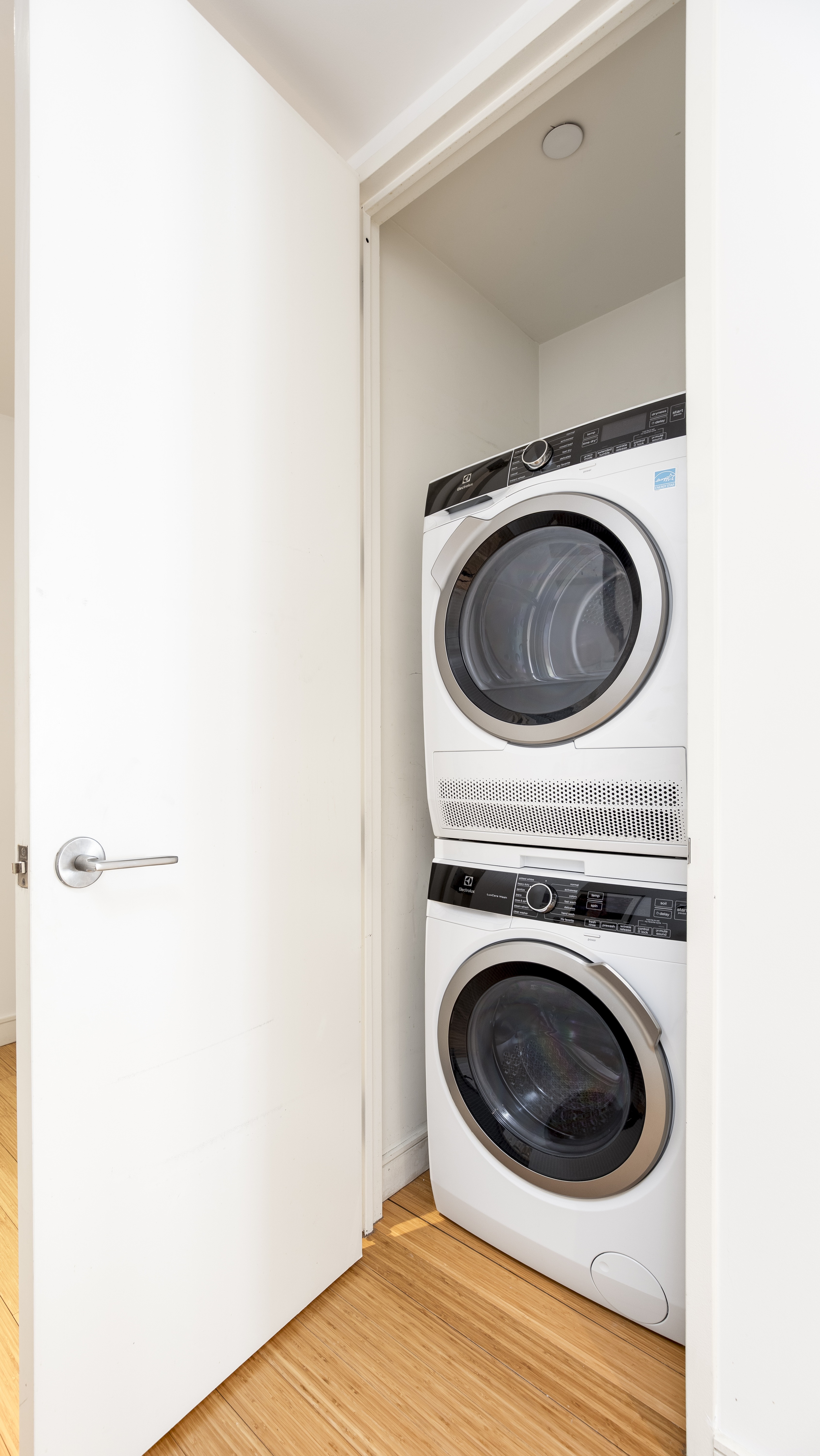 303 East 33rd Street, Unit 7N Manhattan, NY 10016 - Photo 11 of 12 a utility room with dryer and washer
