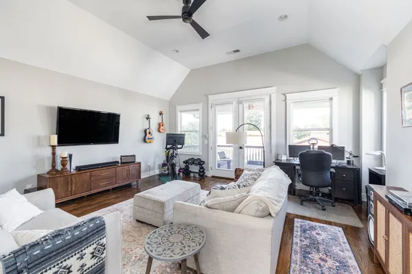 a bedroom with a bed and a book shelf