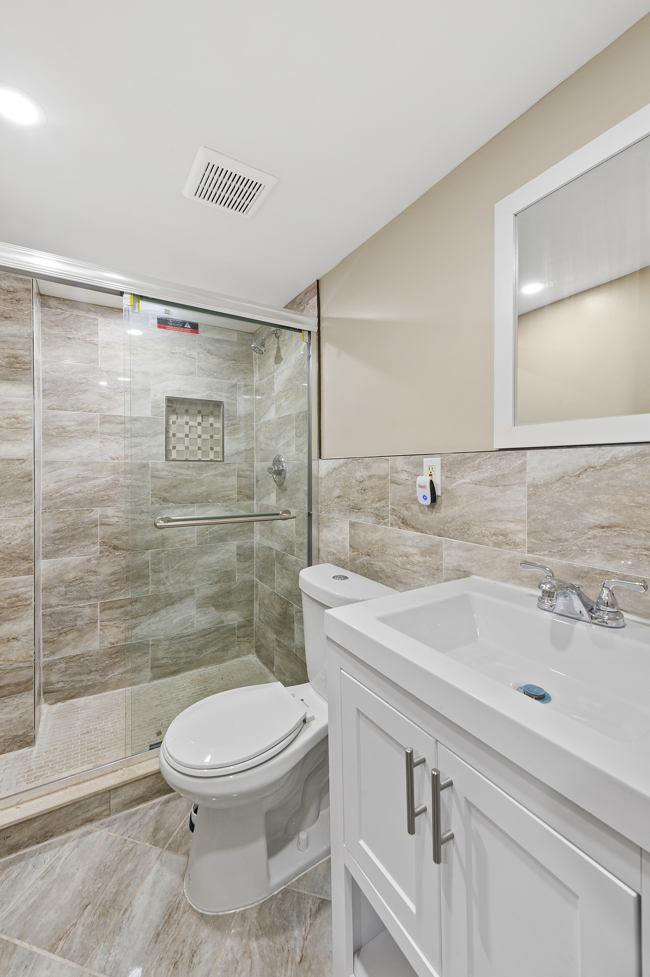194 Pulaski Street, Unit 1 Brooklyn, NY 11206 - Photo 5 of 6 a bathroom with a sink toilet and shower
