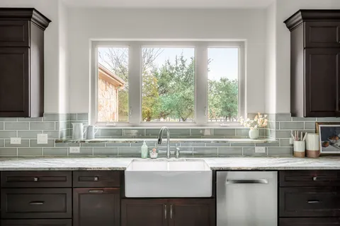 a spacious bedroom with a bed and a fireplace