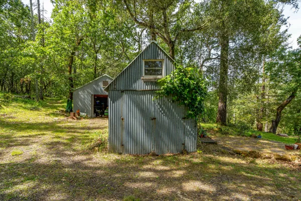 a backyard of a house with lots of trees
