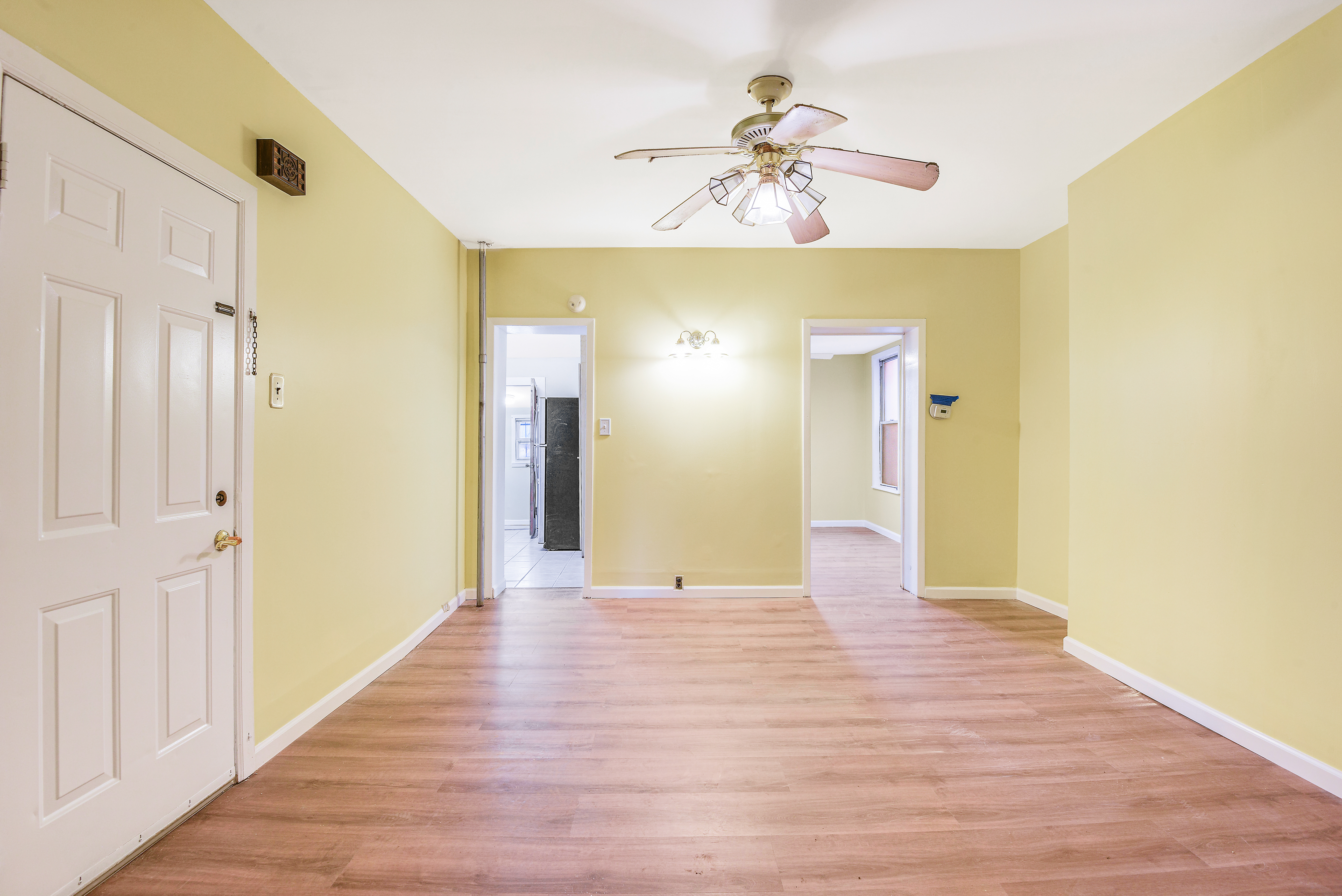 35-47 30th Street, Unit 1 Queens, NY 11106 - Photo 2 of 15 a view of an empty room with wooden floor
