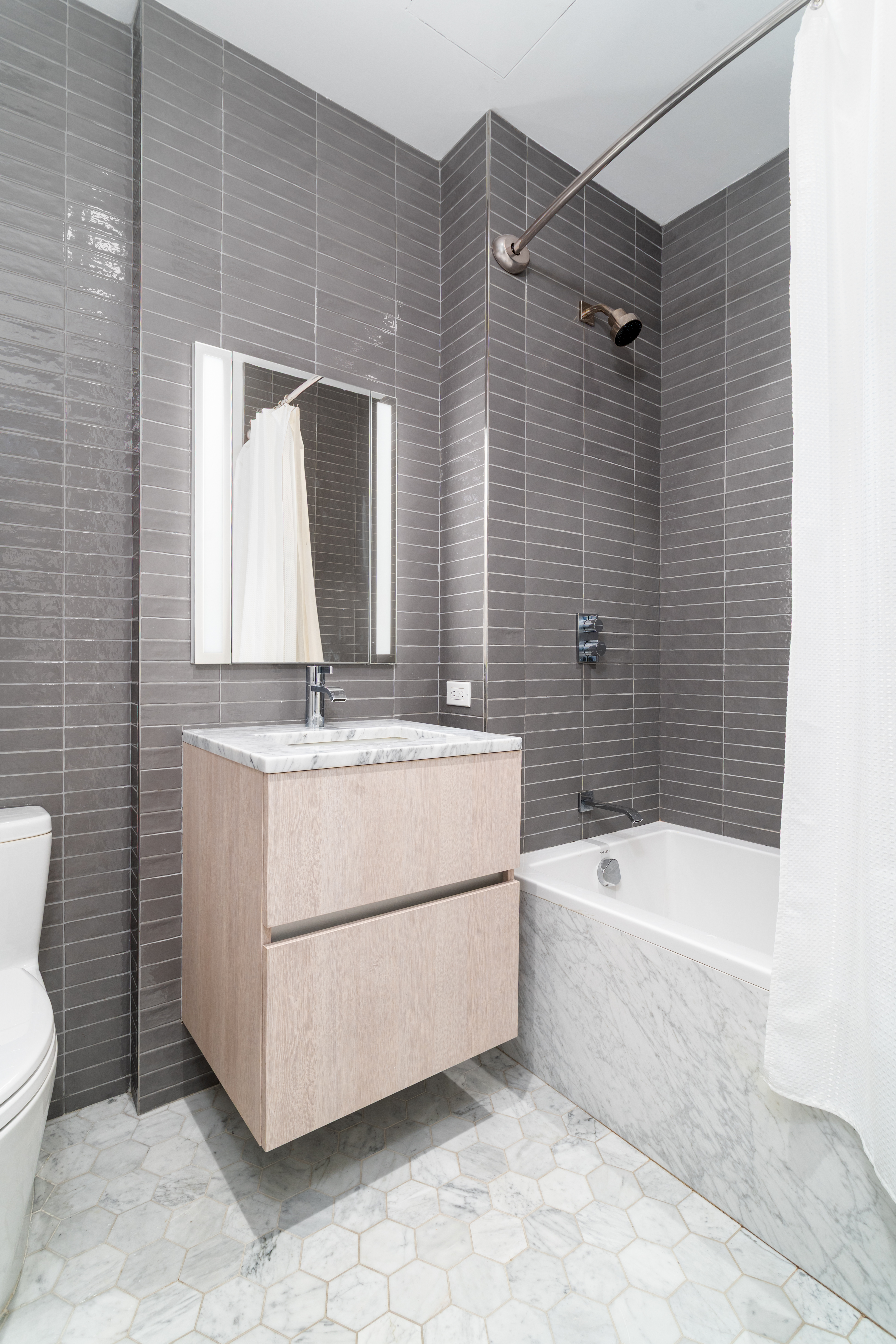 856 Washington Avenue, Unit 5A Brooklyn, NY 11238 - Photo 14 of 19 a bathroom with a sink a toilet and bathtub