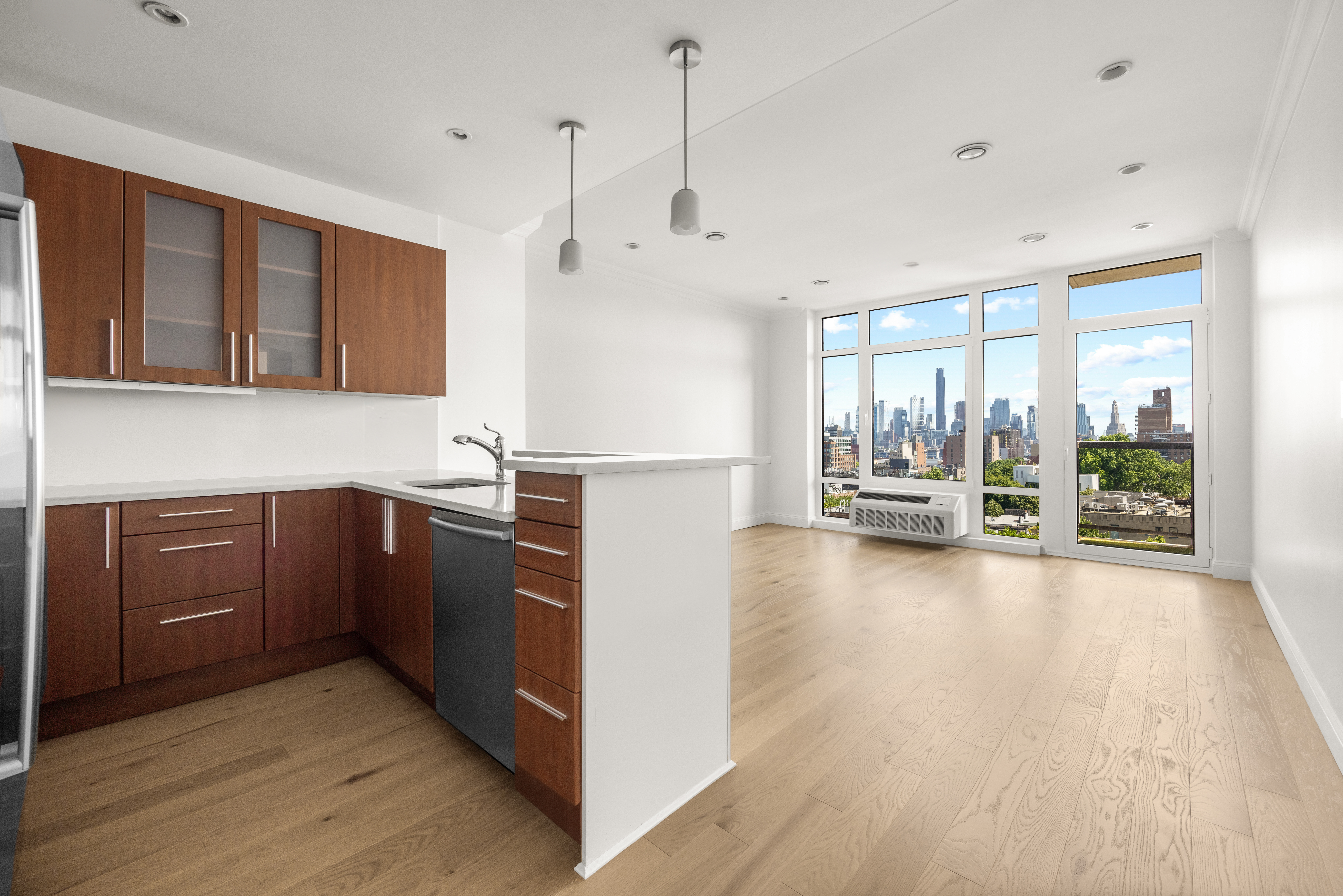 162 16th Street, Unit 7E Brooklyn, NY 11215 - Photo 3 of 23 a kitchen with kitchen island a large counter top space a sink stainless steel appliances and cabinets
