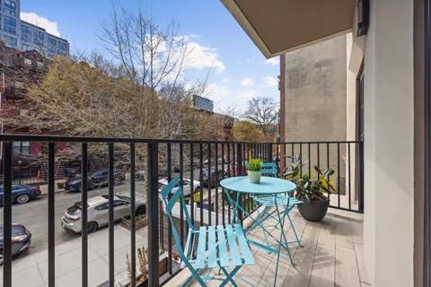 a view of a balcony and chairs