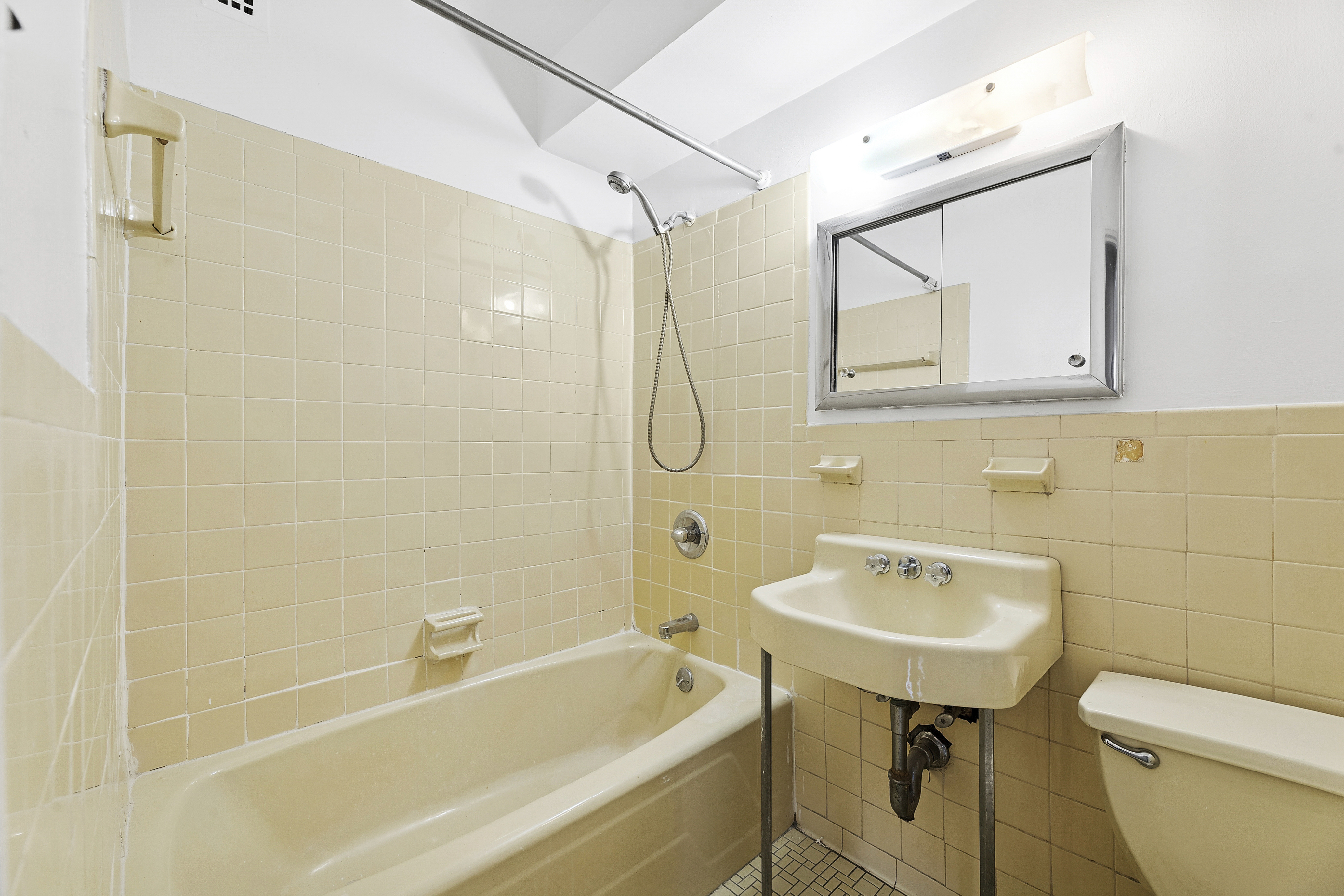 3755 Henry Hudson Parkway West, Unit 3F Bronx, NY 10463 - Photo 15 of 17 a bathroom with a sink a toilet and shower