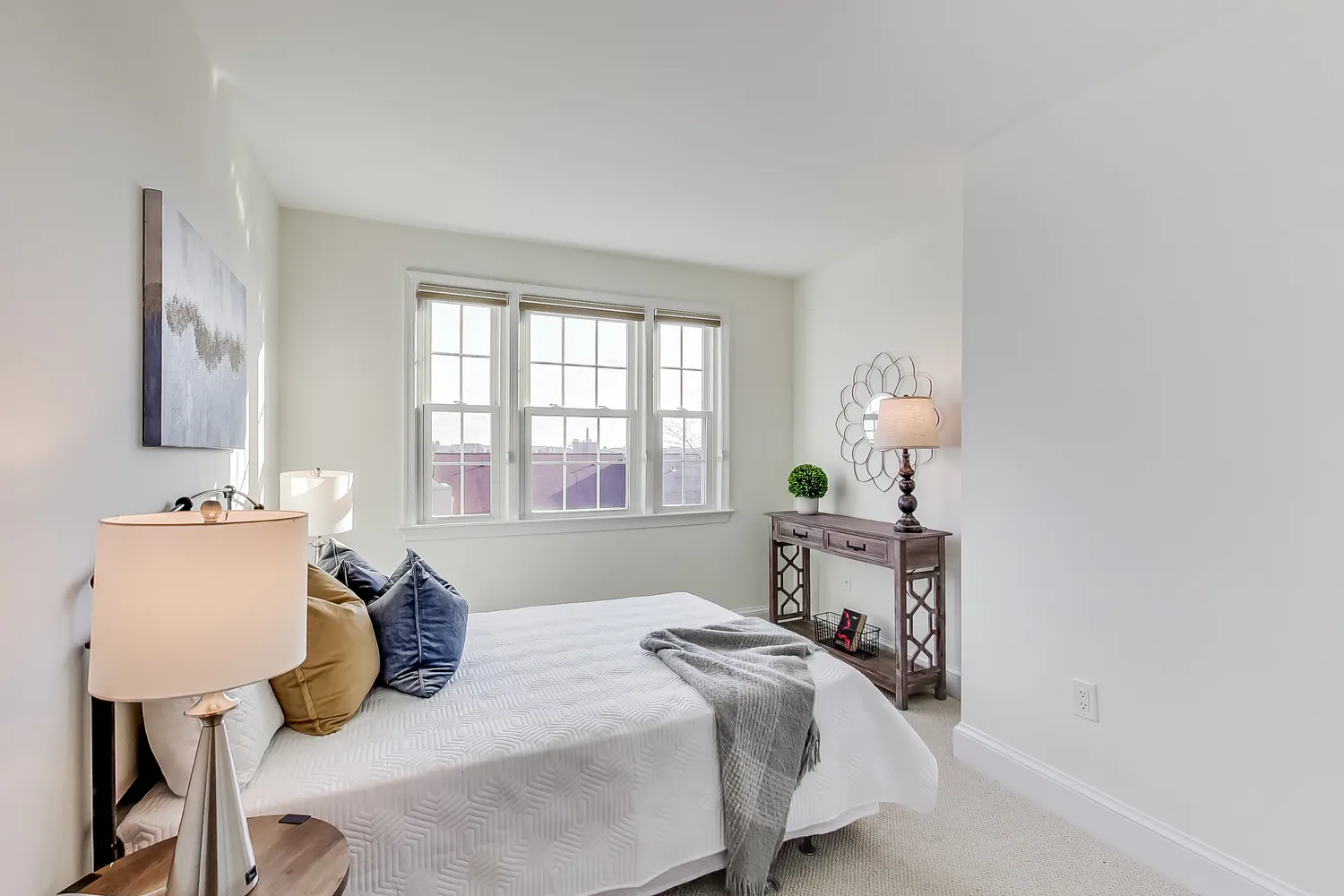 a bedroom with a bed and a table in it