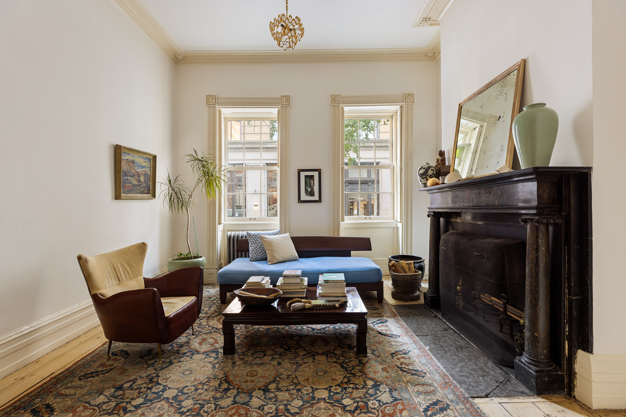 13 Vandam Street Manhattan, NY 10014 - Photo 2 of 26 a living room with furniture and a fireplace