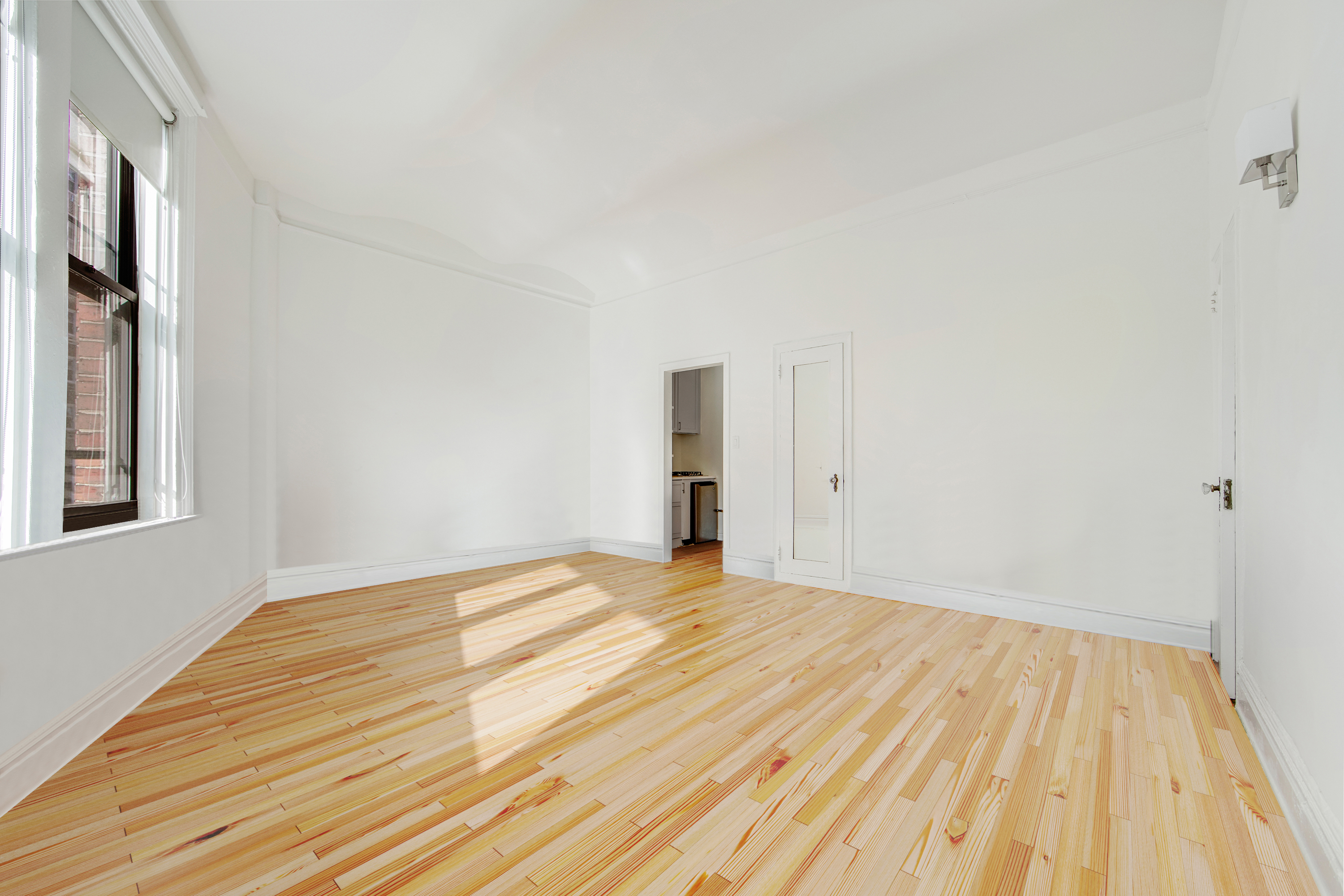 1 Sheridan Square, Unit 4E Manhattan, NY 10014 - Photo 3 of 10 a view of empty room with wooden floor and fan