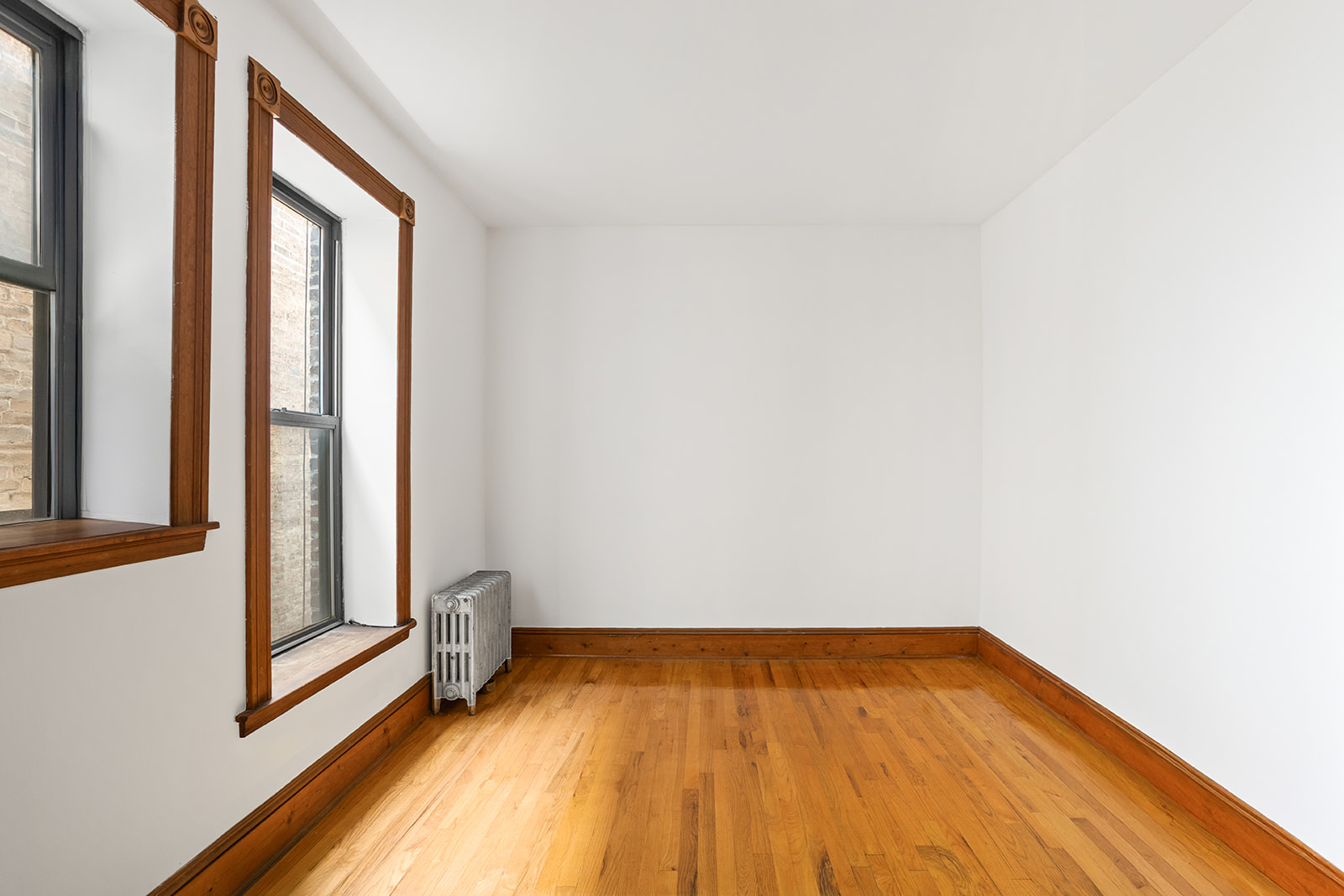 416 Clermont Avenue, Unit 3F Brooklyn, NY 11238 - Photo 8 of 12 a view of a room with wooden floor and small window