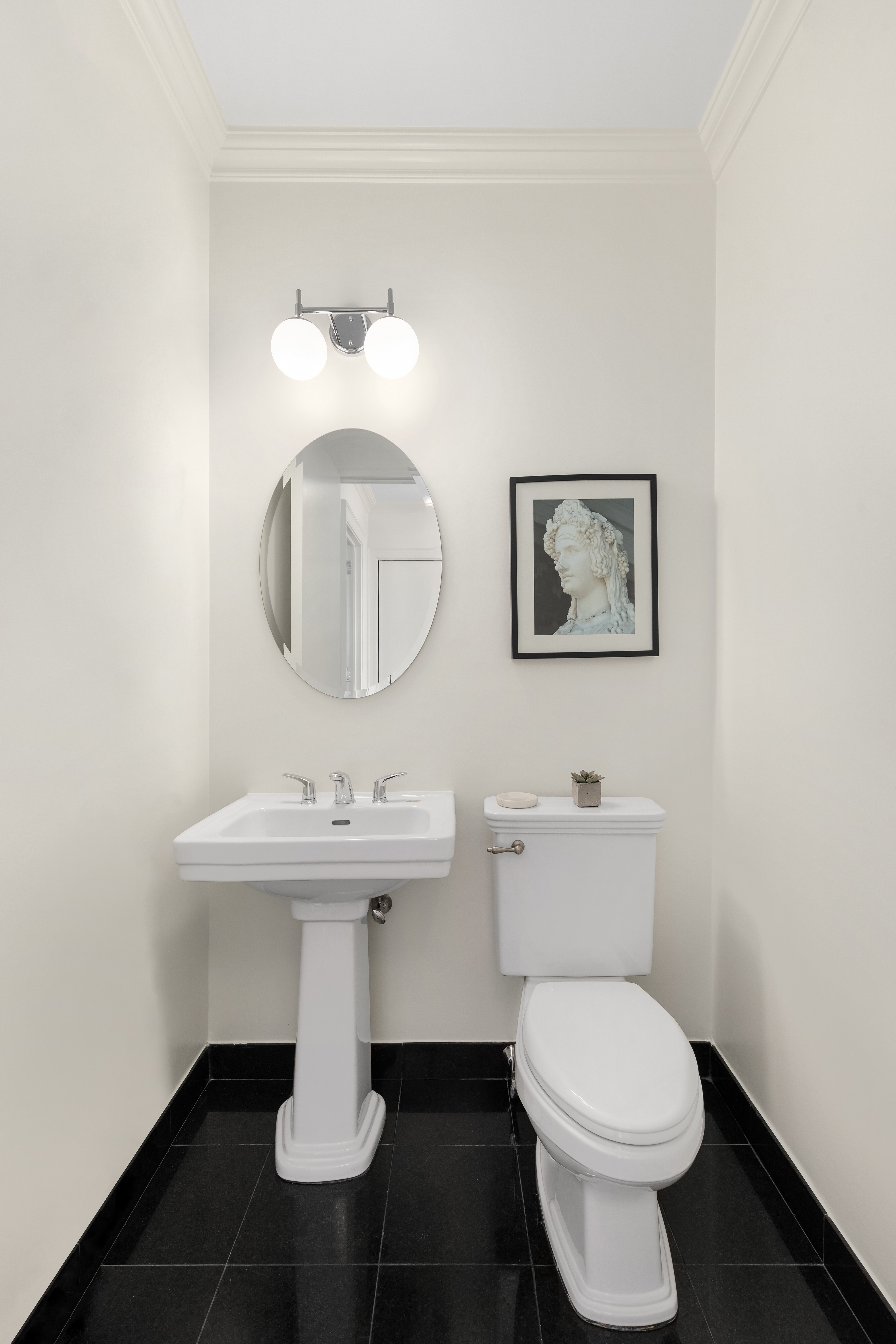 360 East 88th Street, Unit 31C Manhattan, NY 10128 - Photo 17 of 24 a bathroom with a toilet sink and mirror