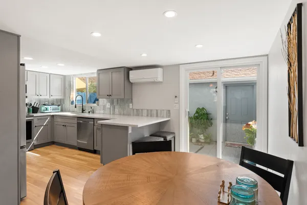 a kitchen with counter top space cabinets and appliances