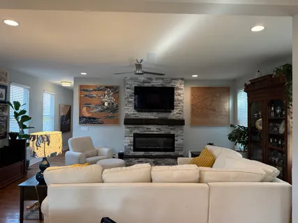 a living room with furniture and a flat screen tv