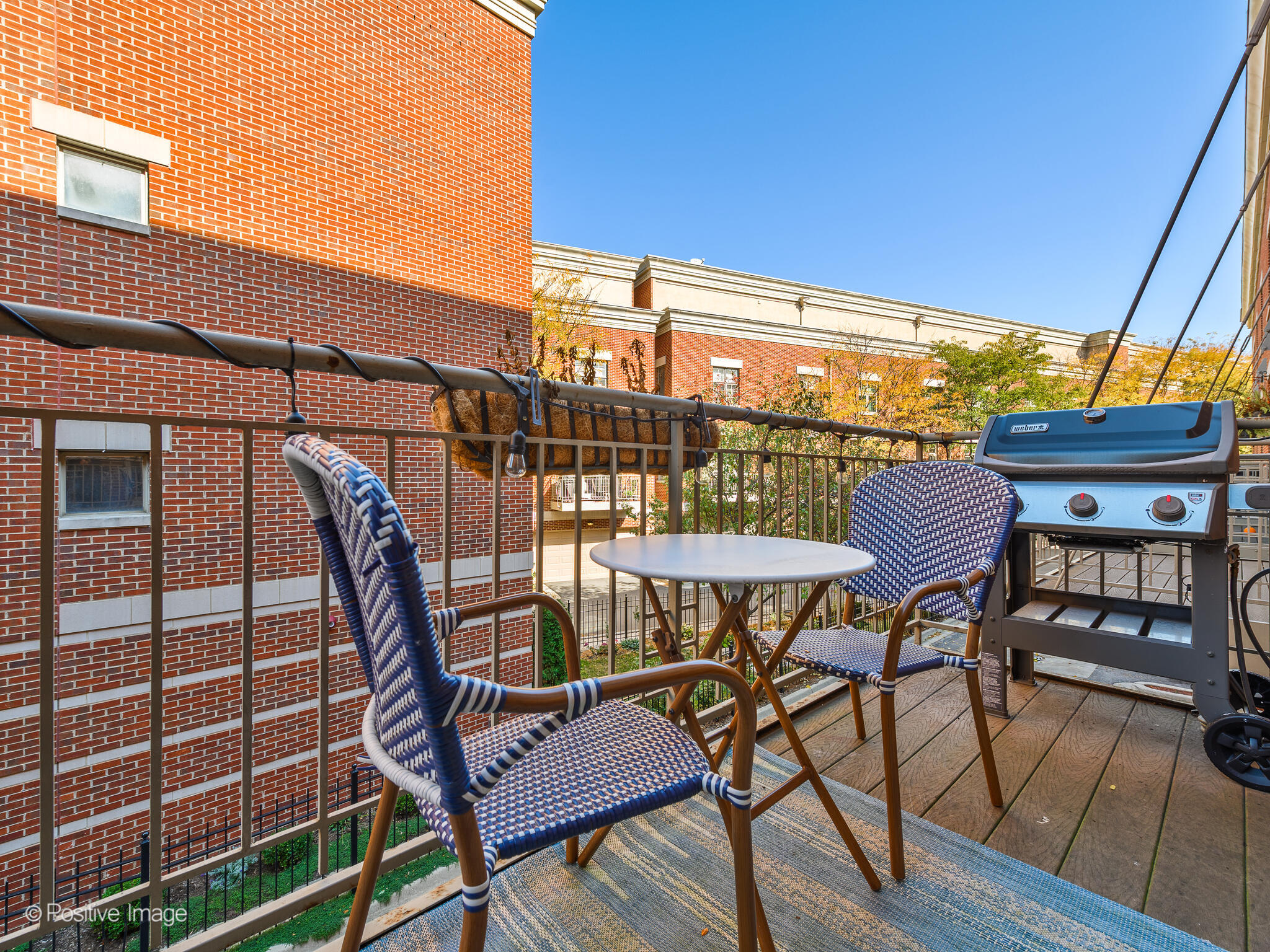 855 North May Street, Unit G Chicago, IL 60642 - Photo 16 of 28 a view of a chairs and table in the patio