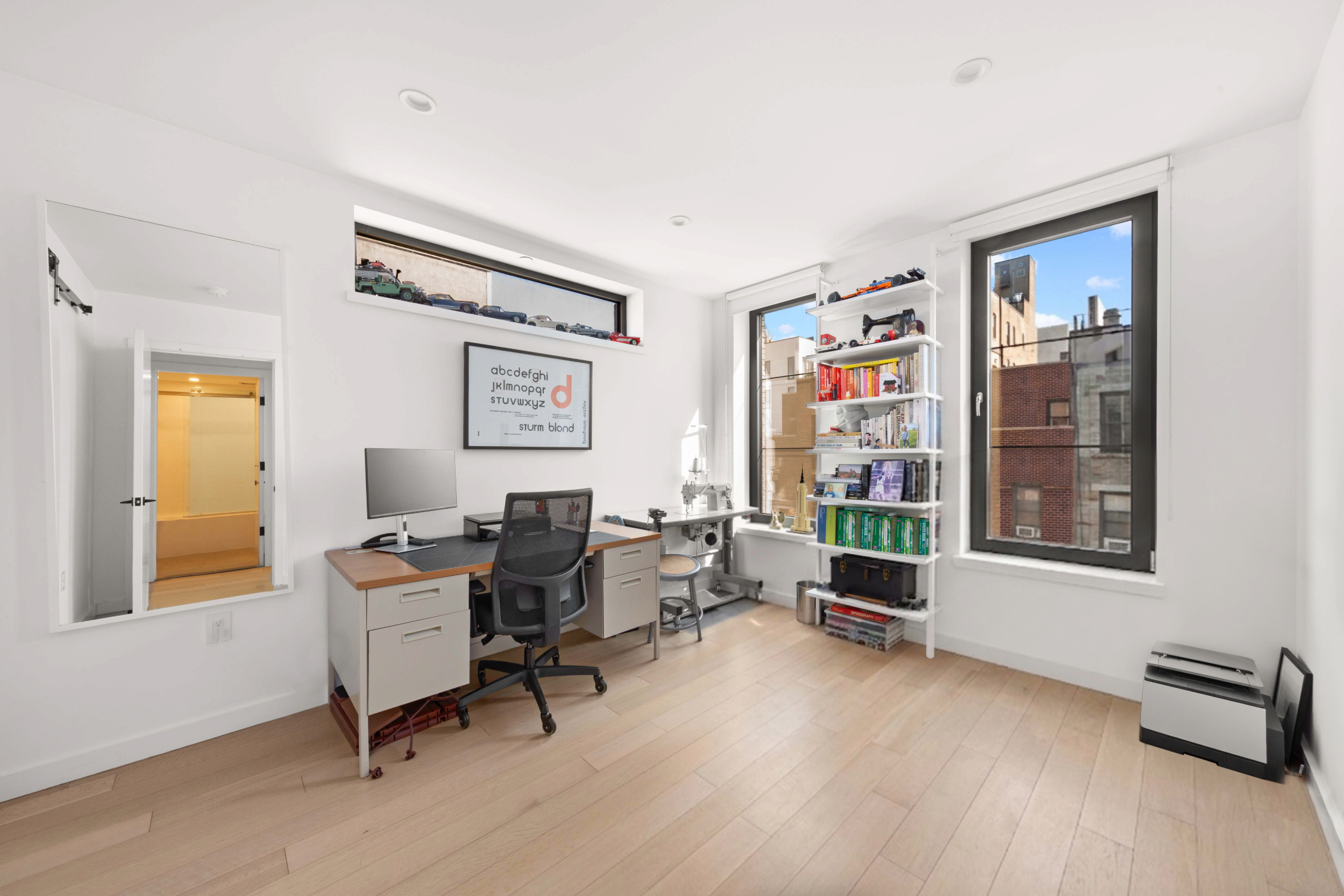 33 Conselyea Street, Unit PH Brooklyn, NY 11211 - Photo 11 of 16 a workspace with furniture hardwood and a window
