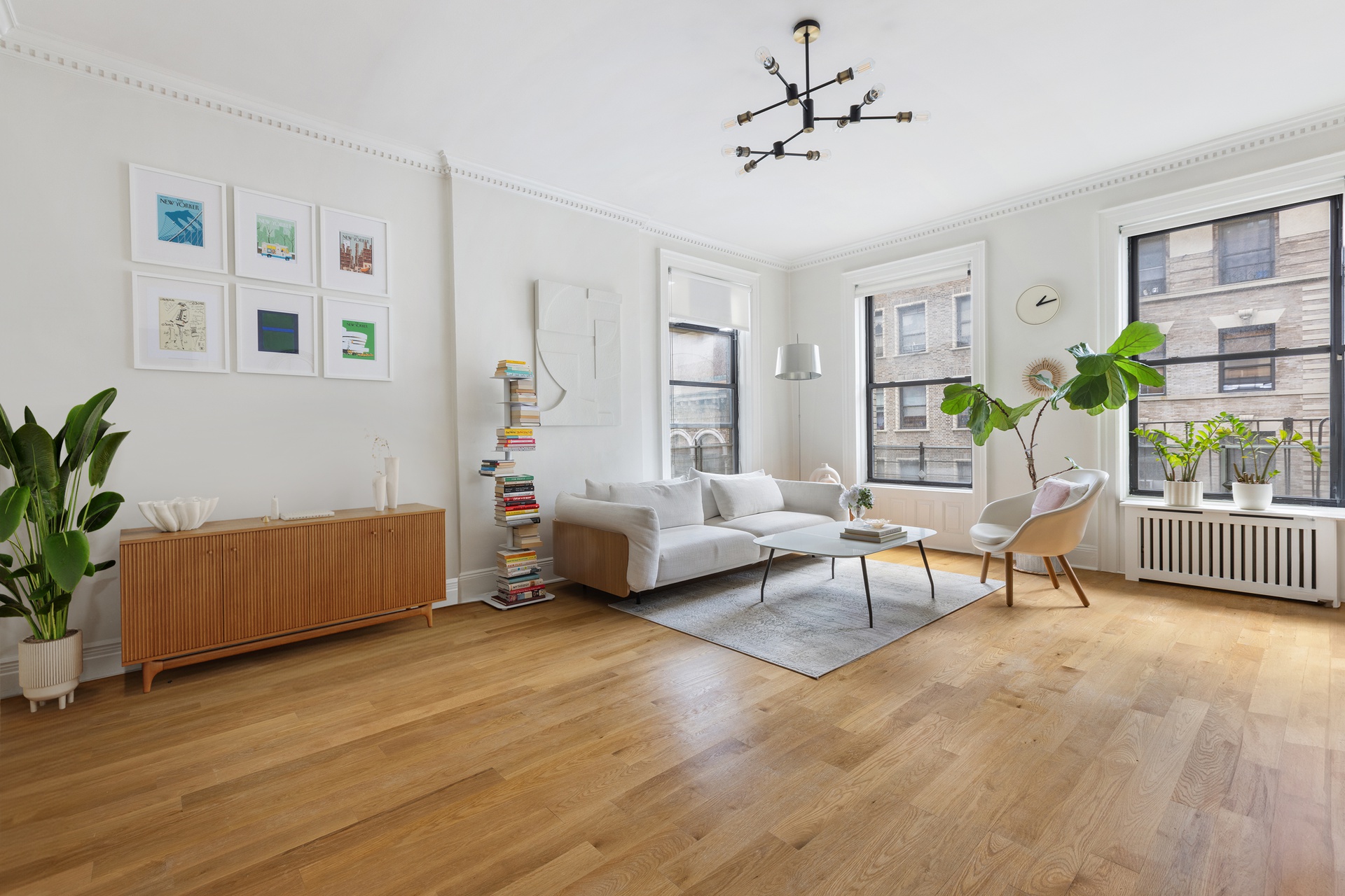 229 West 97th Street, Unit 5M New York, NY 10025 - Photo 2 of 11 a living room with furniture and a wooden floor