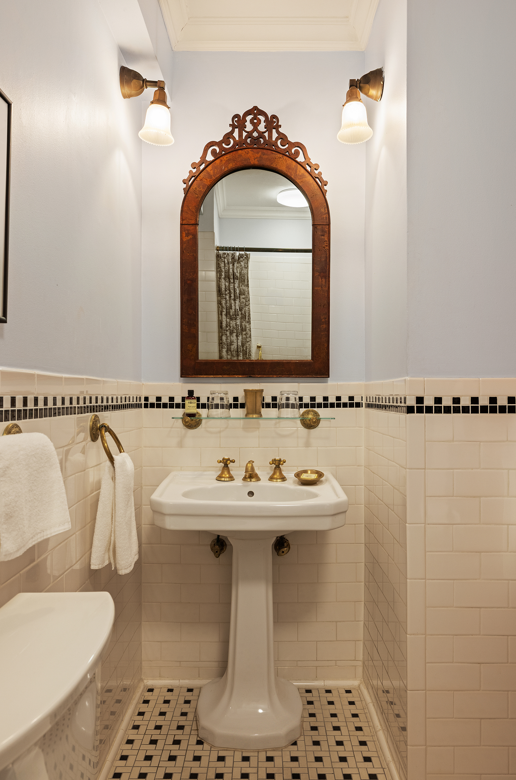 54 Irving Place, Unit 3 Manhattan, NY 10003 - Photo 5 of 11 a bathroom with a sink a mirror and a shower