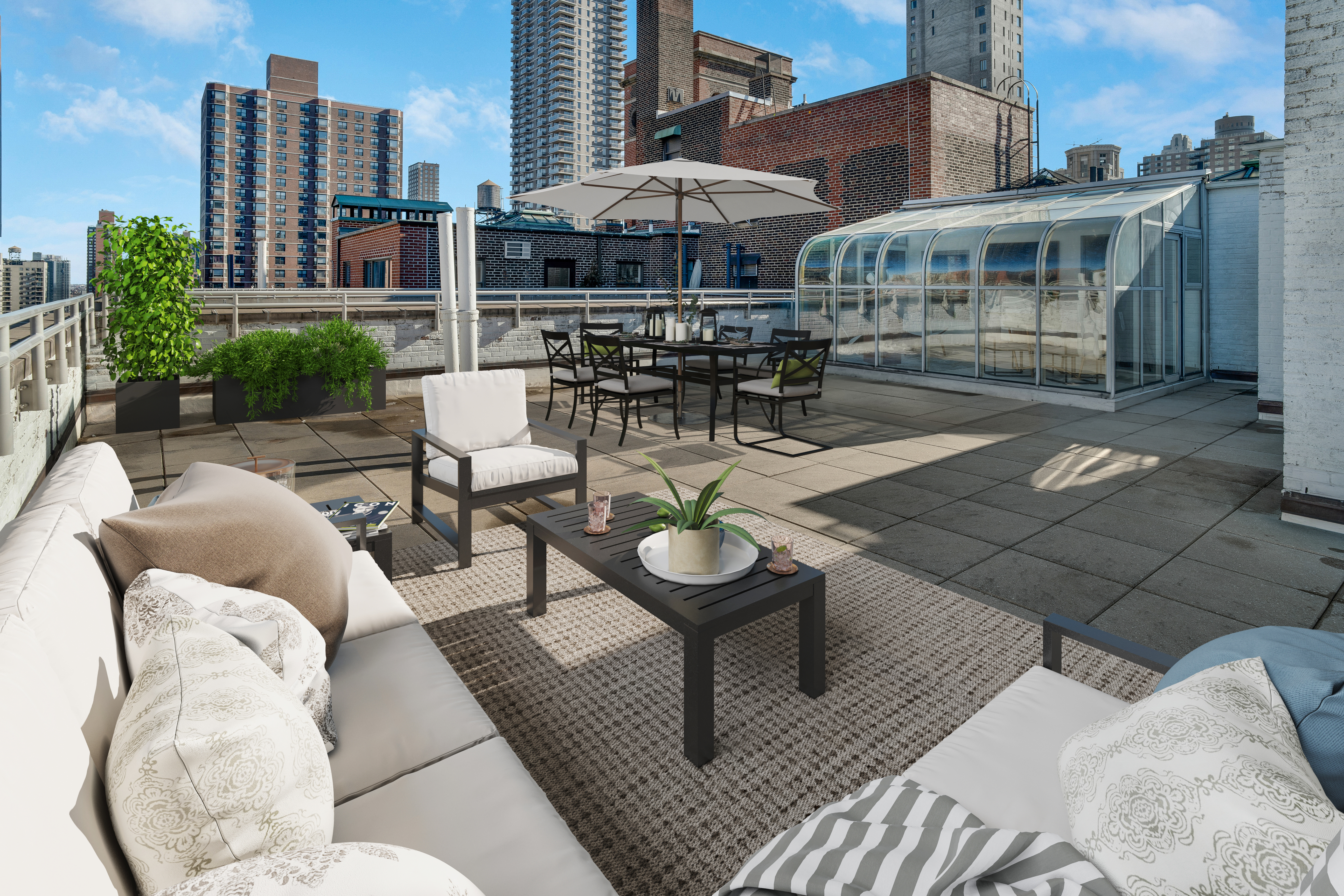 1349 Lexington Avenue, Unit PH2 Manhattan, NY 10128 - Photo 4 of 18 a view of a patio with couches table and chairs under an umbrella with a fire pit