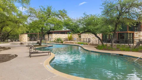 a view of a swimming pool with chairs