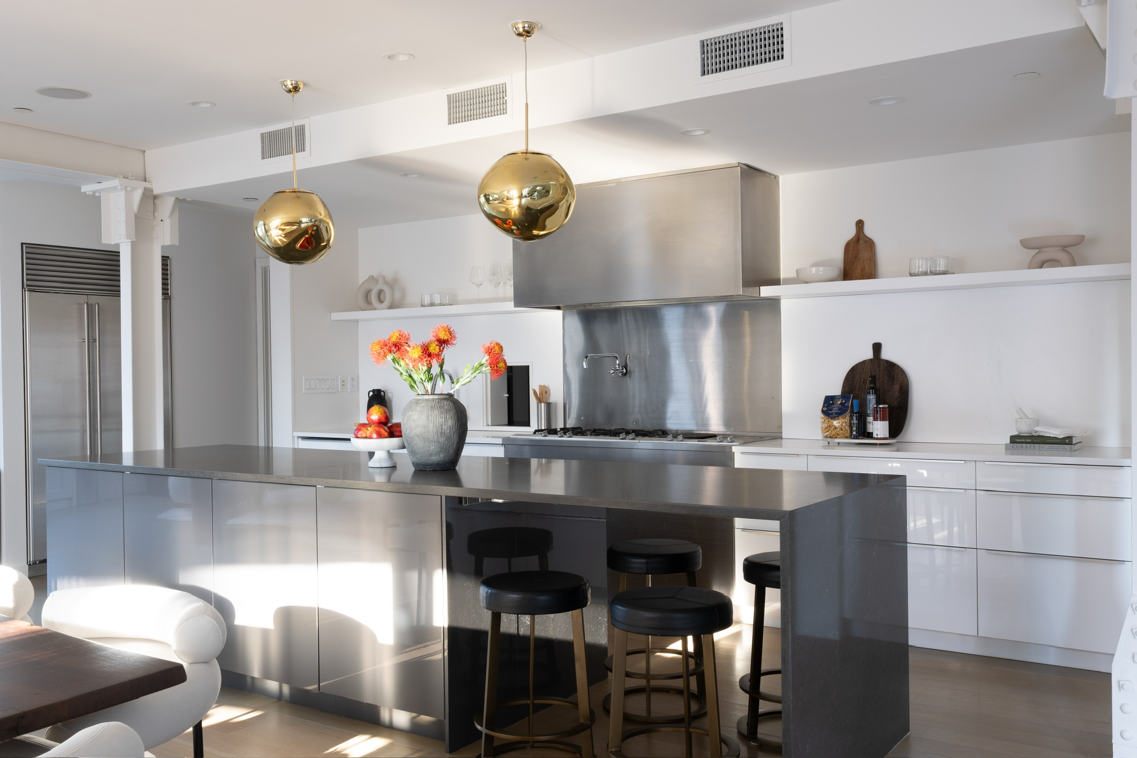 1200 Broadway, Unit PH89 Manhattan, NY 10001 - Photo 16 of 47 a kitchen with stainless steel appliances granite countertop a stove and chairs
