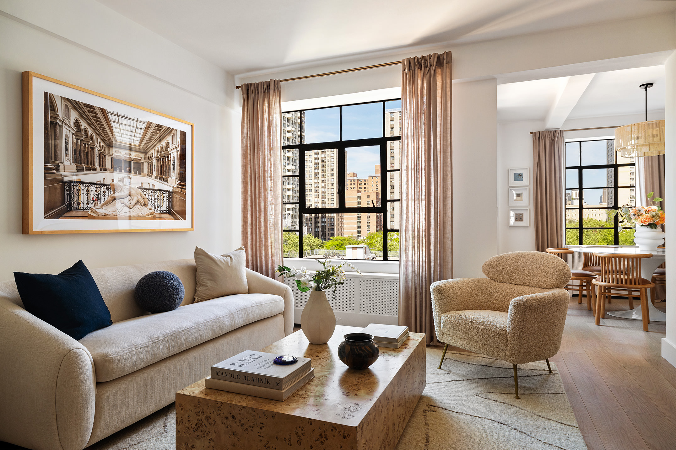 320 Central Park West, Unit 7L Manhattan, NY 10025 - Photo 4 of 16 a living room with furniture and floor to ceiling windows