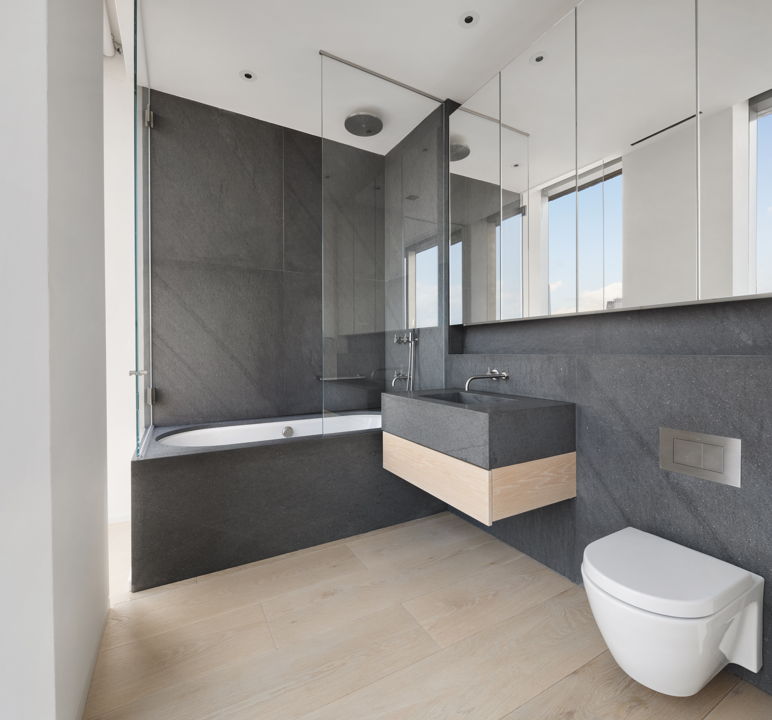 215 Chrystie Street, Unit PH2 Manhattan, NY 10002 - Photo 22 of 30 a bathroom with a bathtub and a window