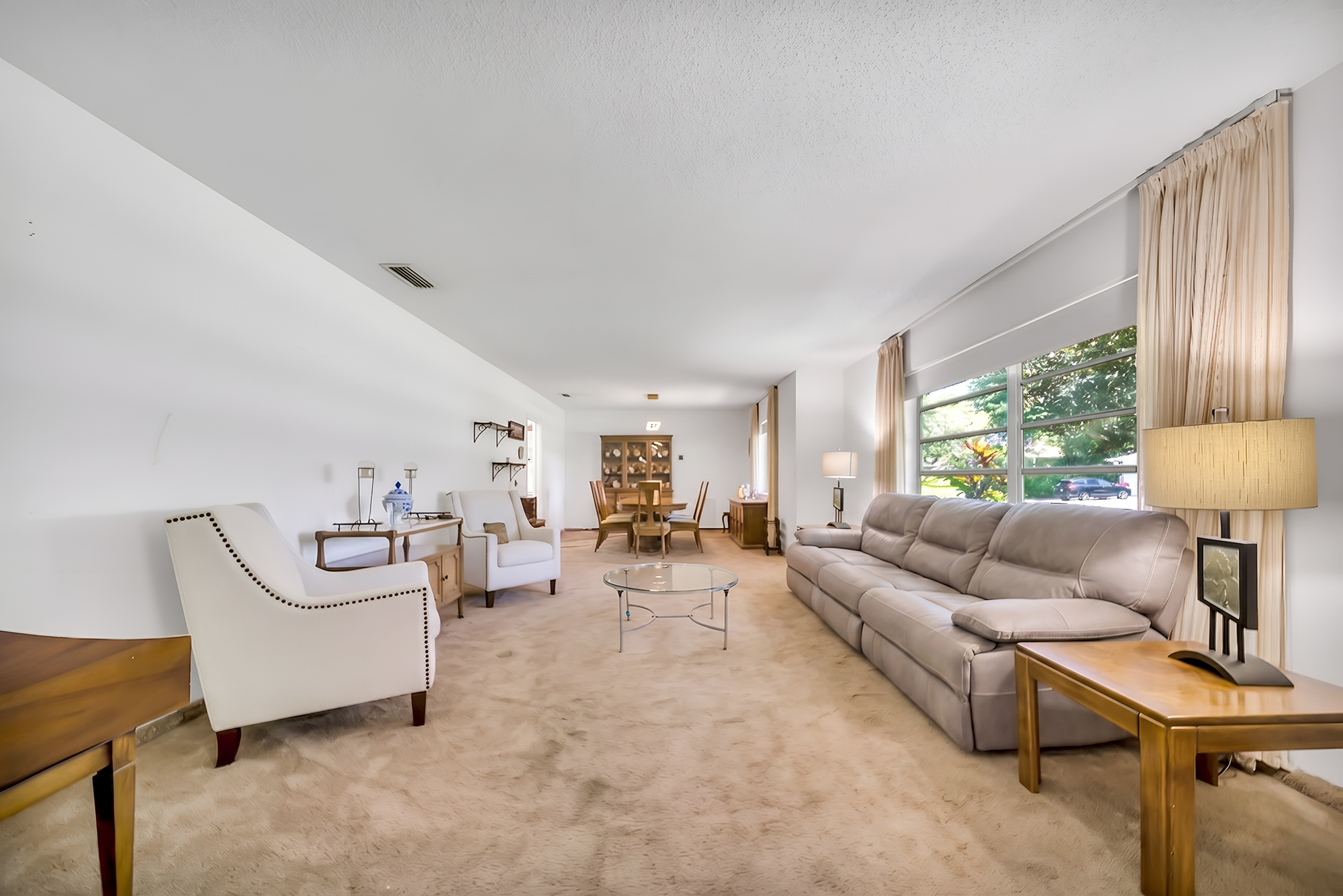 6760 Southwest 62nd Terrace Miami, FL 33143 - Photo 9 of 38 a living room with furniture and a large window