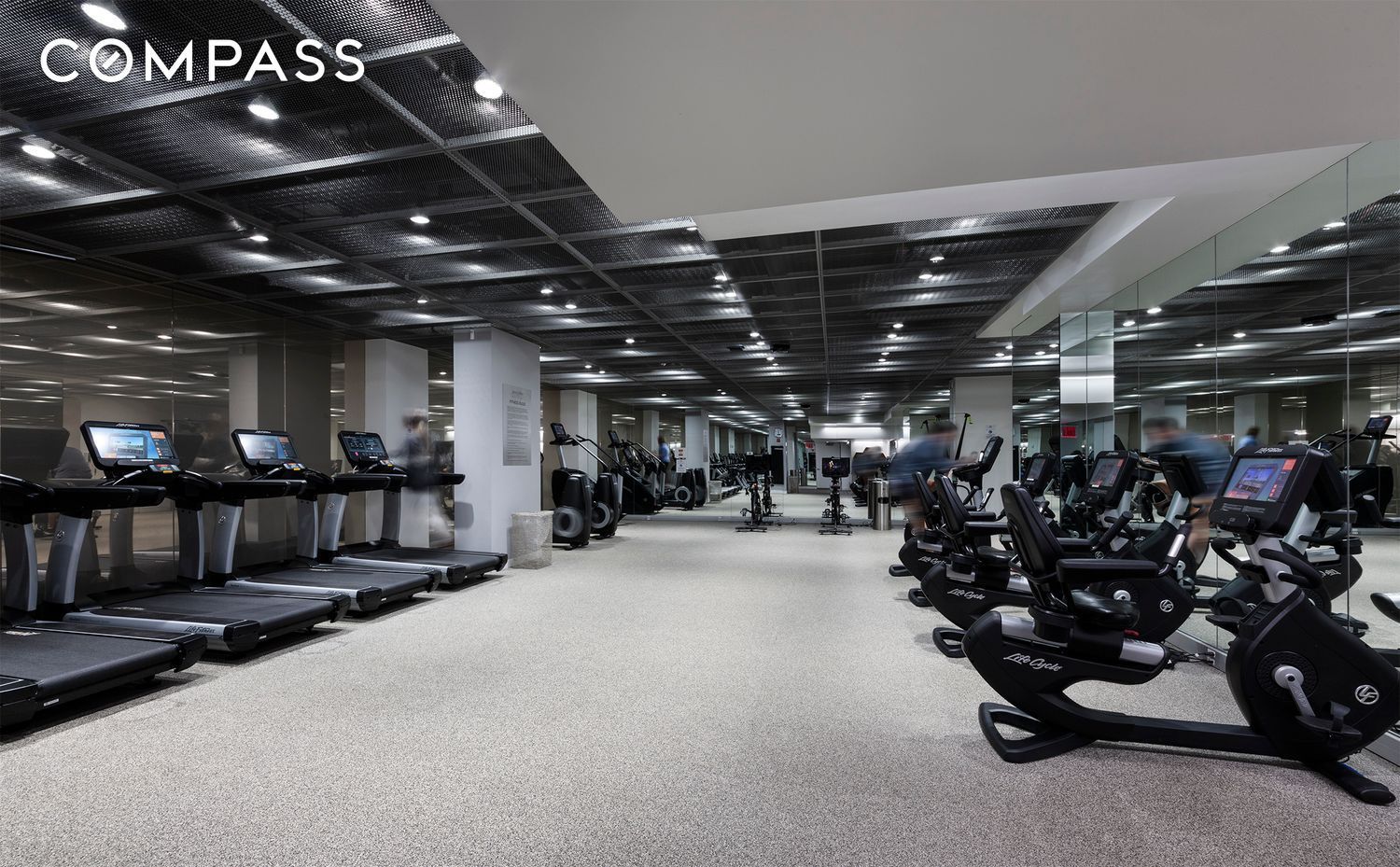 200 East 66th Street, Unit D1203 Manhattan, NY 10065 - Photo 20 of 24 a view of a room with gym equipment