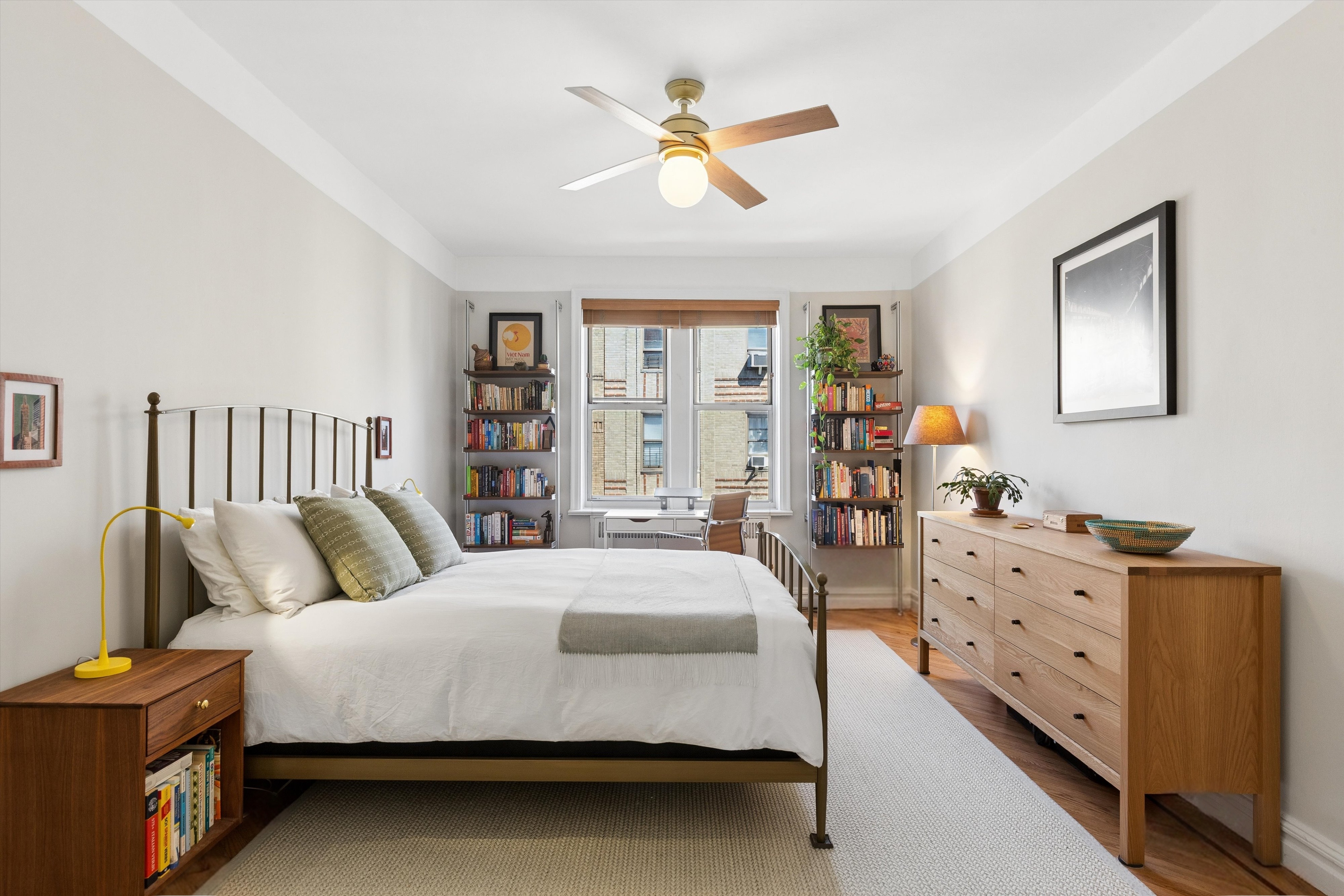 680 West 204th Street, Unit 5F Manhattan, NY 10034 - Photo 5 of 15 a spacious bedroom with a bed and a chandelier
