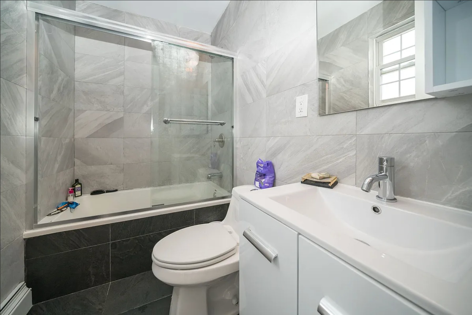 29 Melrose Street, Unit 2 Brooklyn, NY 11206 - Photo 6 of 13 a bathroom with a sink mirror toilet and bathtub