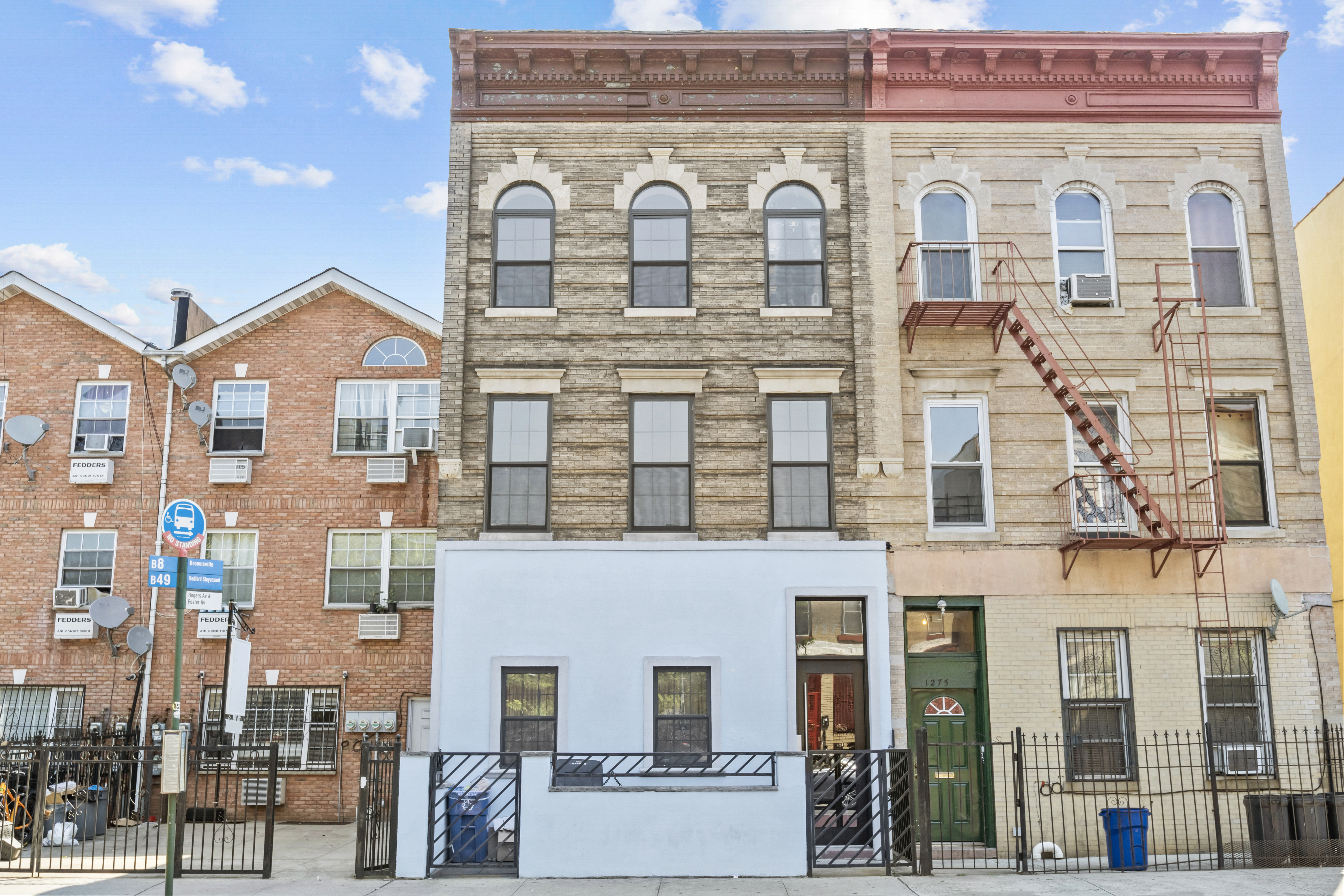 1273 Rogers Avenue, Unit MULTIFAM Brooklyn, NY 11226 - Photo 4 of 13 a front view of a building with glass windows