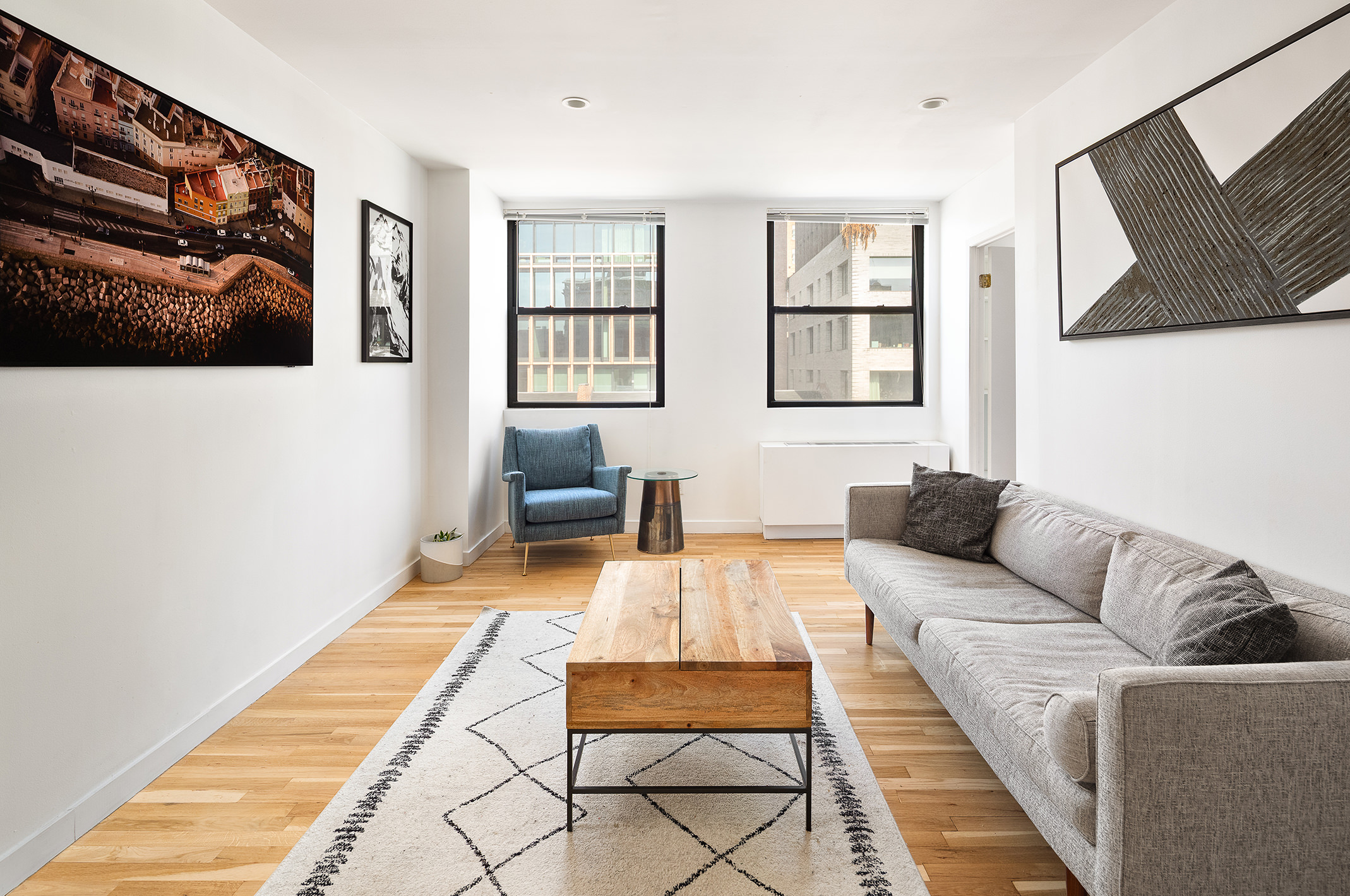 350 West 14th Street, Unit 7E Manhattan, NY 10014 - Photo 2 of 5 a living room with furniture and a couch