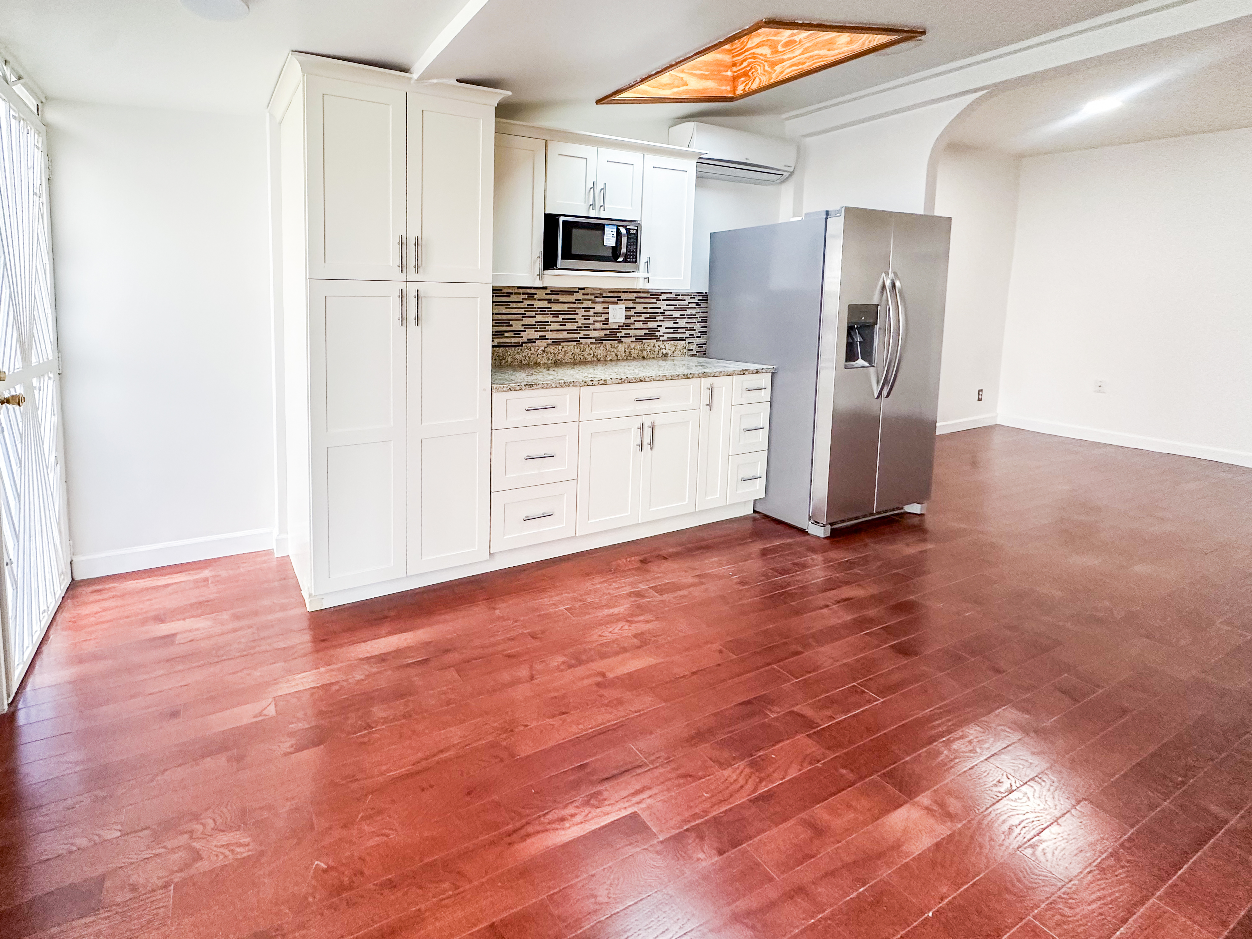 289 A Cooper Street, Unit 2 Brooklyn, NY 11237 - Photo 7 of 19 a kitchen with stainless steel appliances a refrigerator and a stove top oven