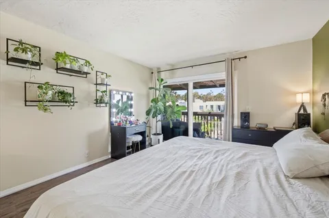 a bedroom with a large bed and a window