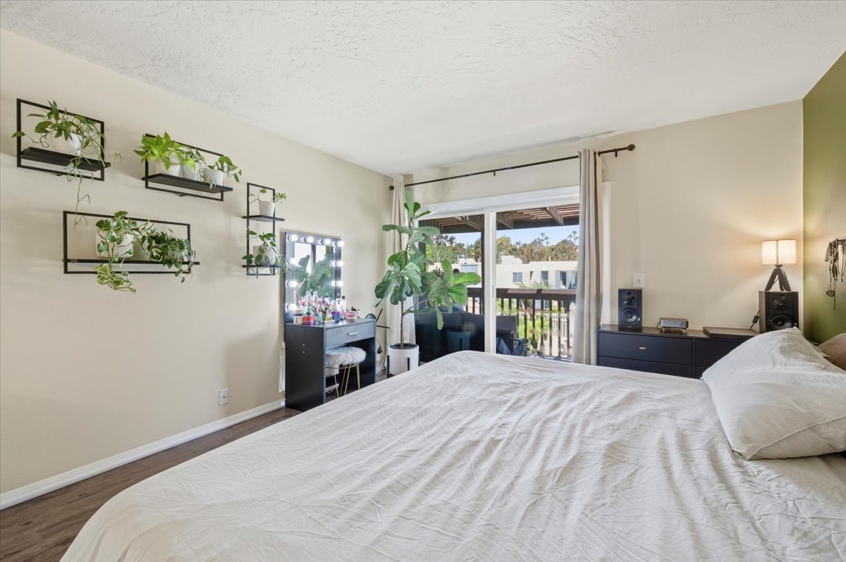 6373 Rancho Mission Road, Unit 5 San Diego, CA 92108 - Photo 14 of 30 a bedroom with a large bed and a window