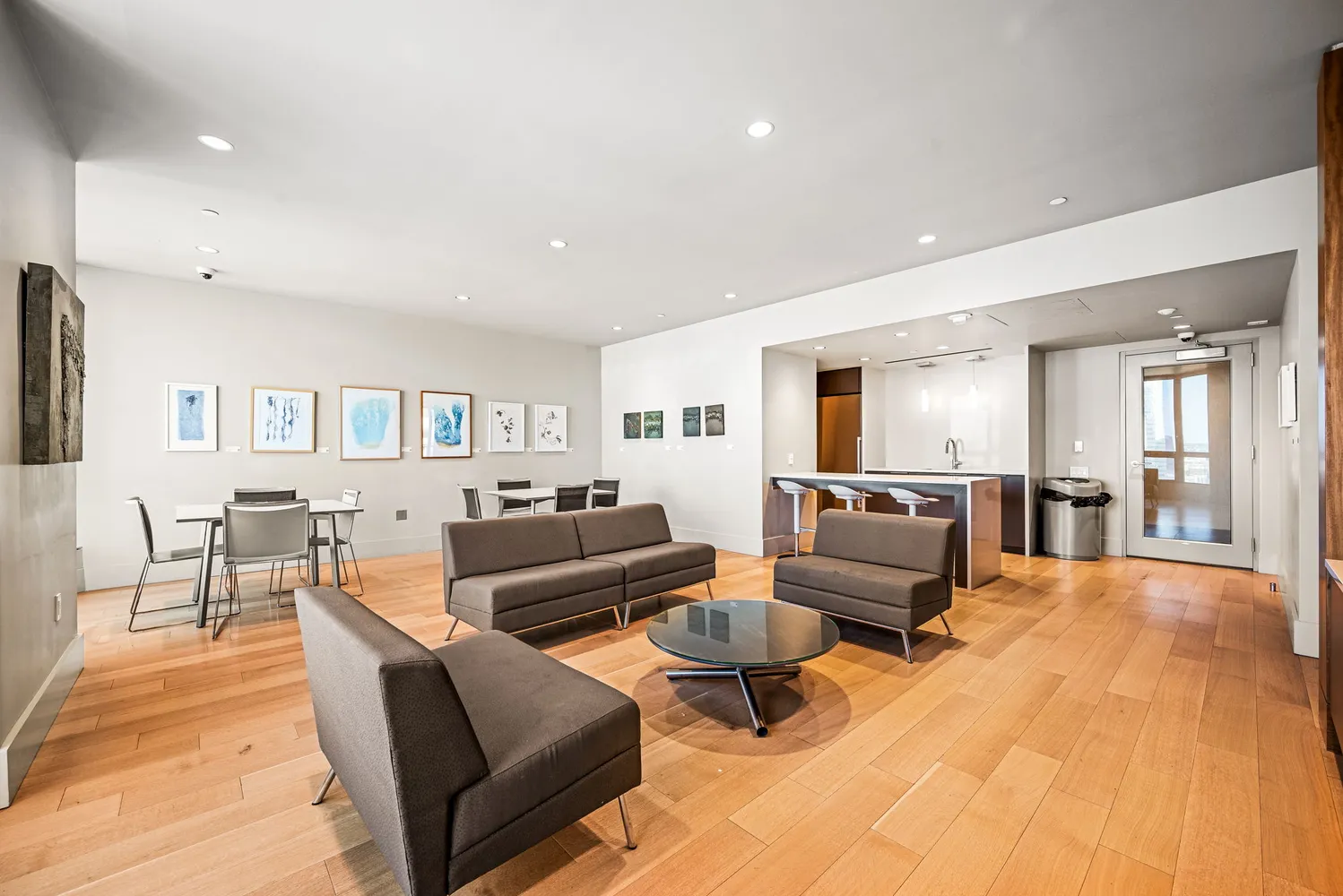 a living room with furniture window and wooden floor