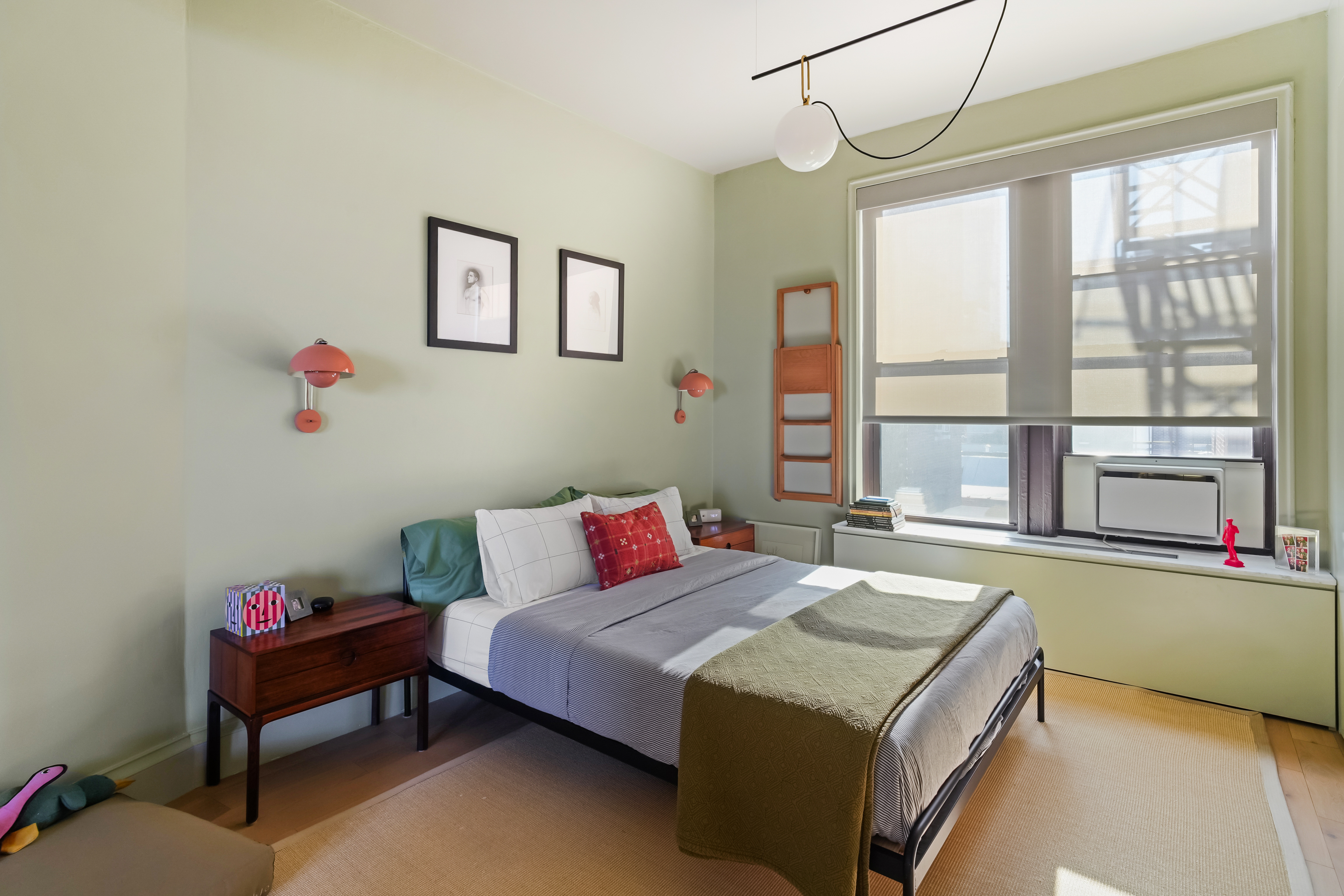 265 Riverside Drive, Unit 11F Manhattan, NY 10025 - Photo 15 of 18 a bedroom with a bed and a window