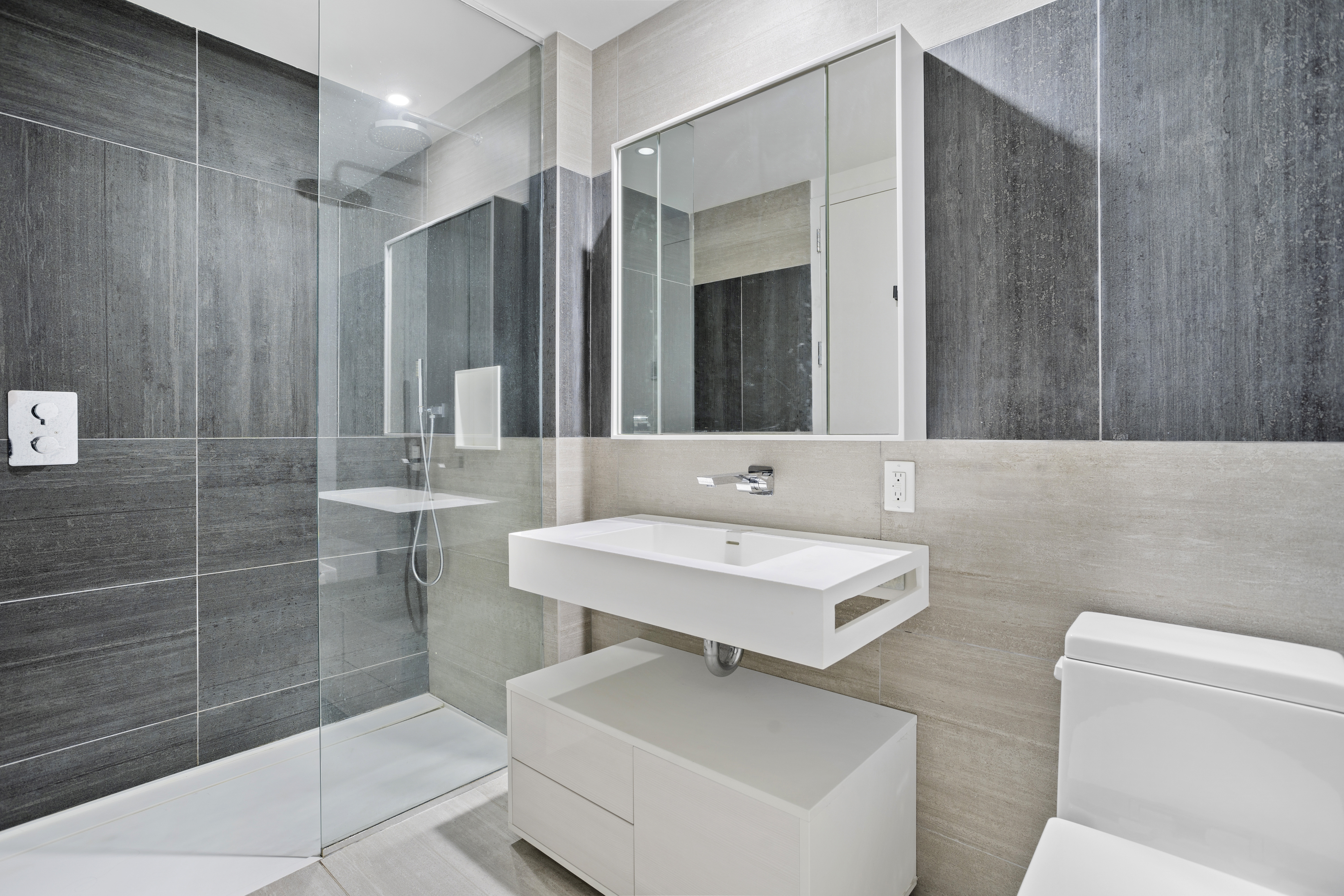 540 West 49th Street, Unit 405S Manhattan, NY 10019 - Photo 4 of 12 a bathroom with a sink toilet and shower
