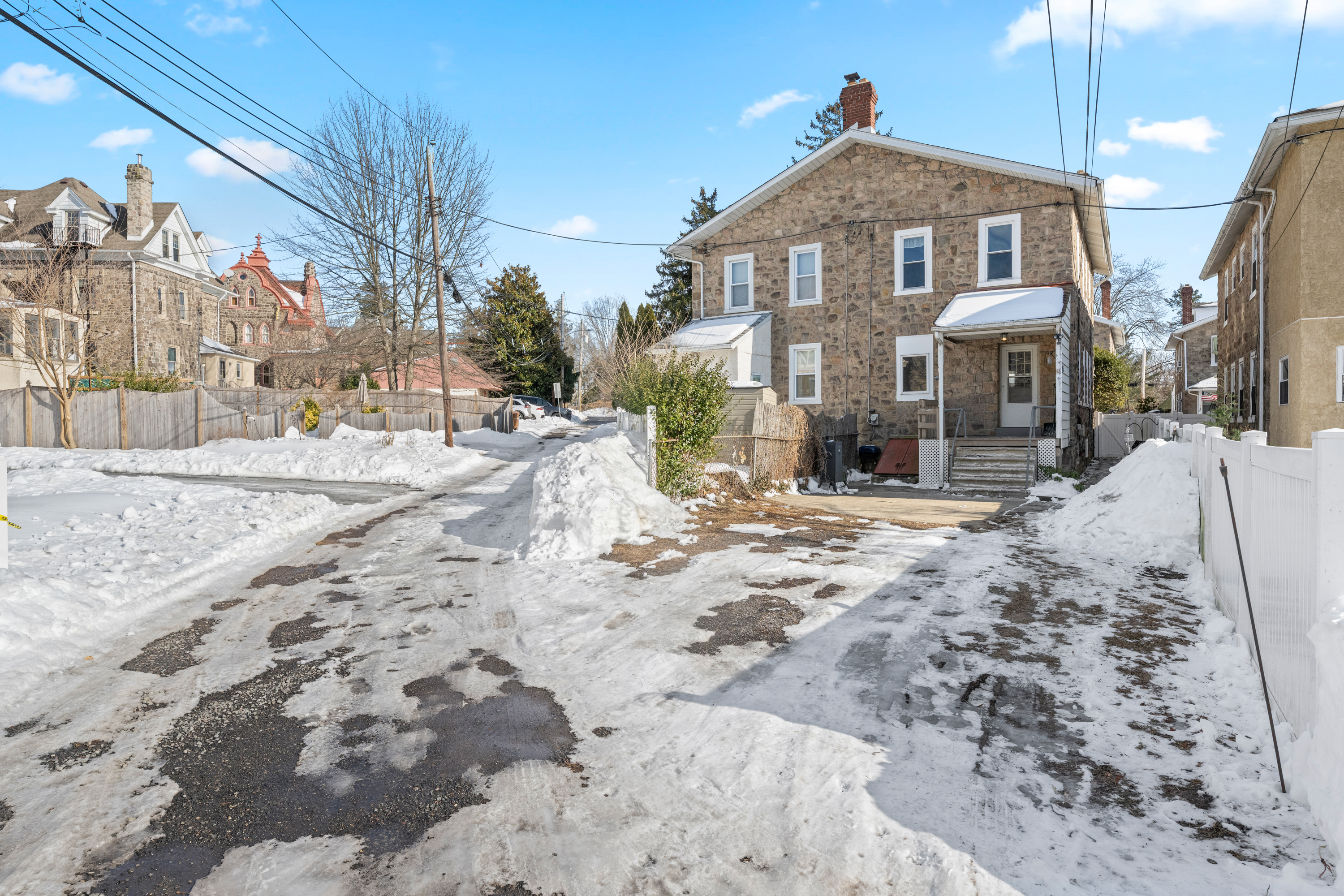 458 Renfrew Avenue Ambler, PA 19002 - Photo 6 of 32 a view of a house with a yard covered in snow
