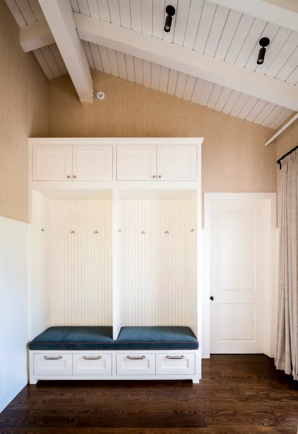 a front view of a building with a tree