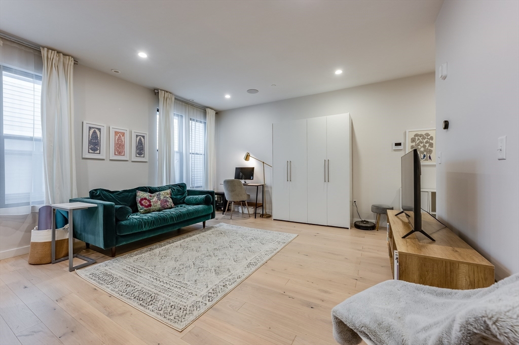 340 West 2nd Street, Unit 5 Boston, MA 02127 - Photo 4 of 26 a living room with furniture and a wooden floor