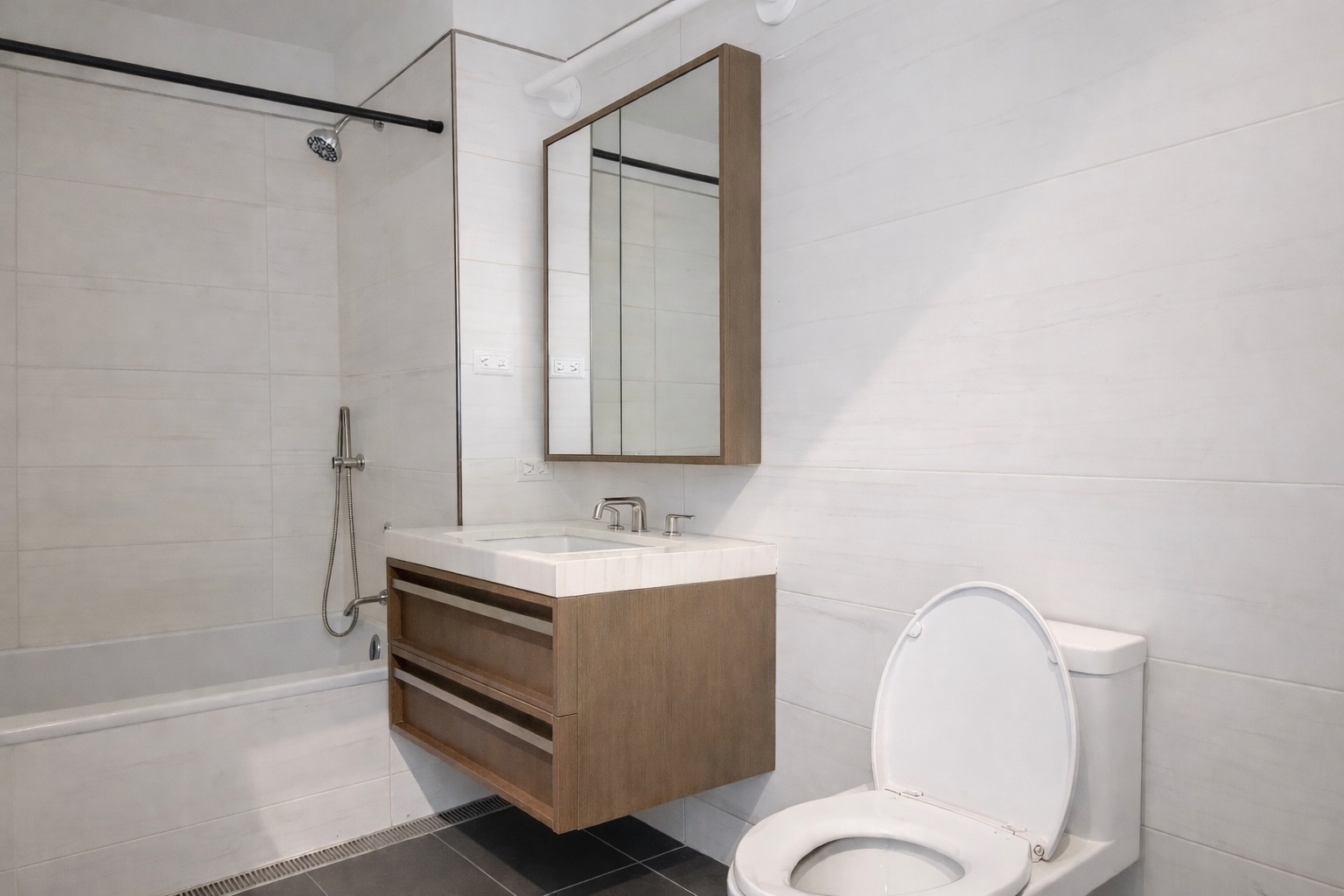 575 4th Avenue, Unit 8B Brooklyn, NY 11215 - Photo 3 of 18 a bathroom with a sink a toilet and shower
