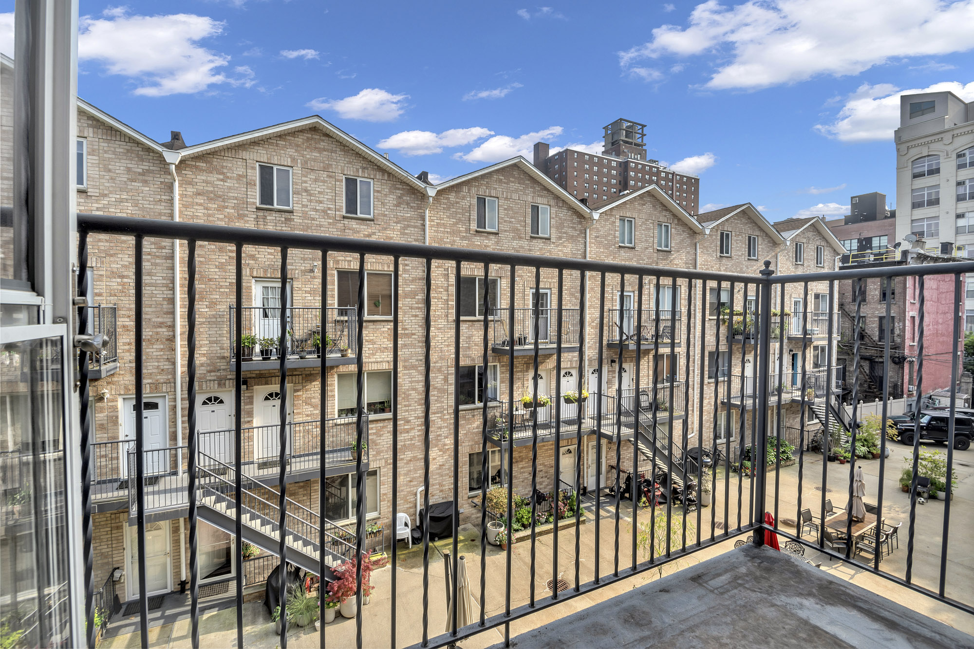 963 Kent Avenue, Unit D3 Brooklyn, NY 11205 - Photo 13 of 16 a view of a brick house with large windows