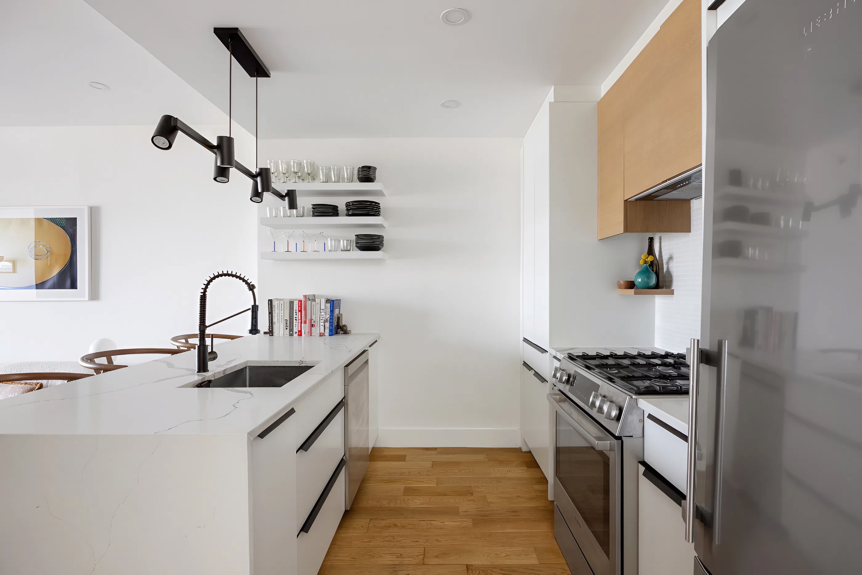 340 Metropolitan Avenue, Unit PHB Brooklyn, NY 11211 - Photo 5 of 18 a kitchen with stainless steel appliances a sink and a stove