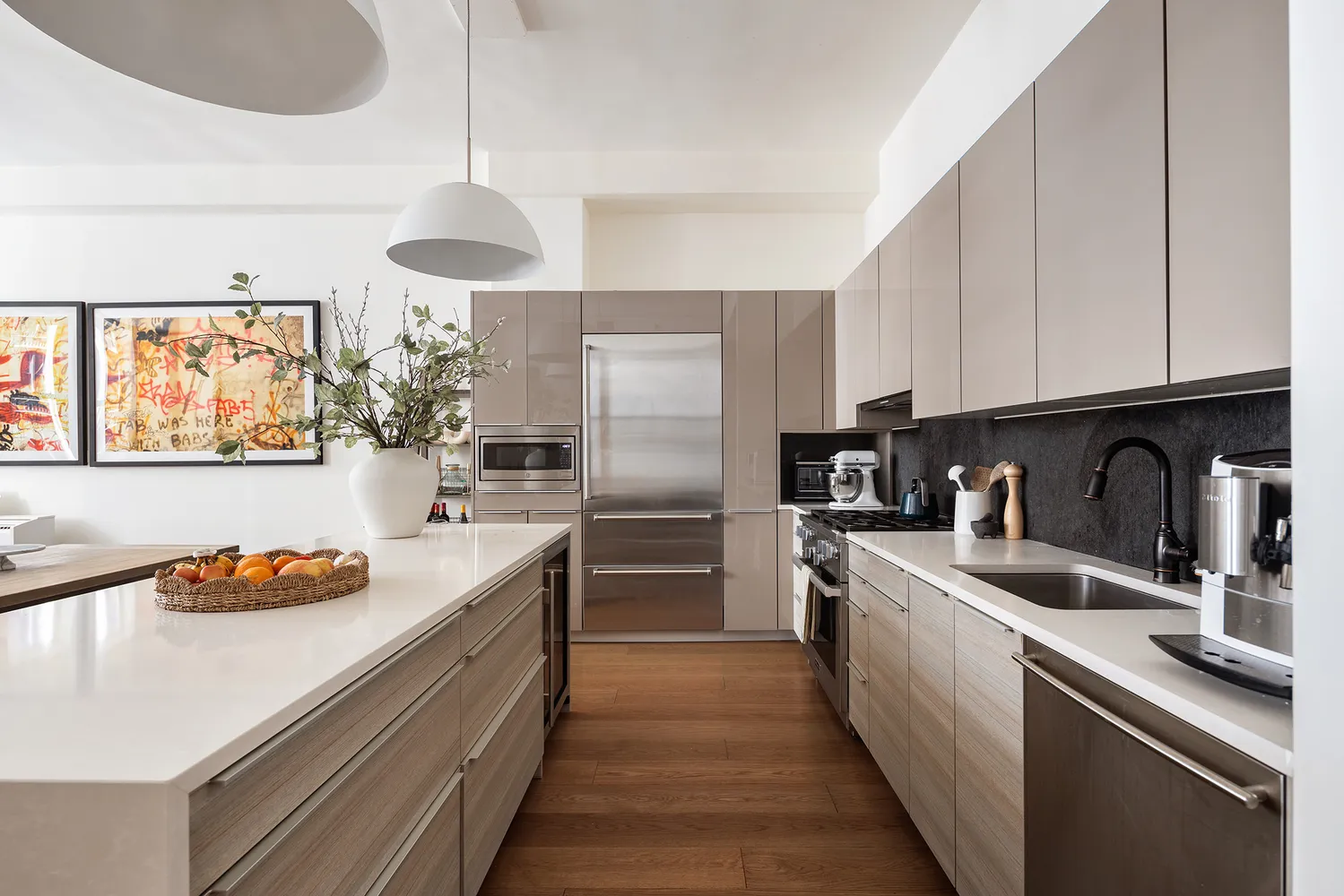 a kitchen with stainless steel appliances granite countertop a sink refrigerator and cabinets